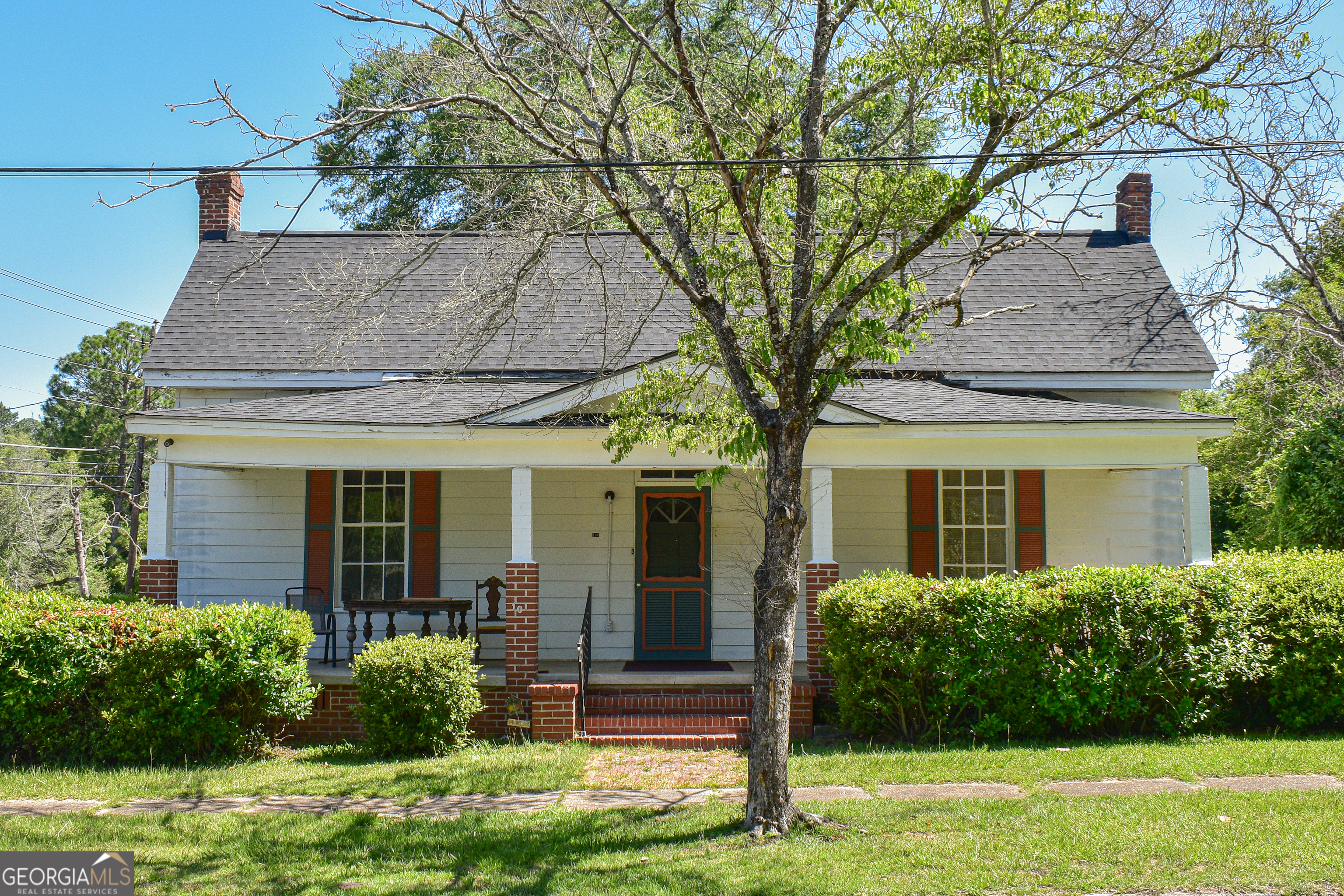 100 Minor Avenue Montezuma, GA 31063 - Photo 2 of 43 a front view of a house with garden