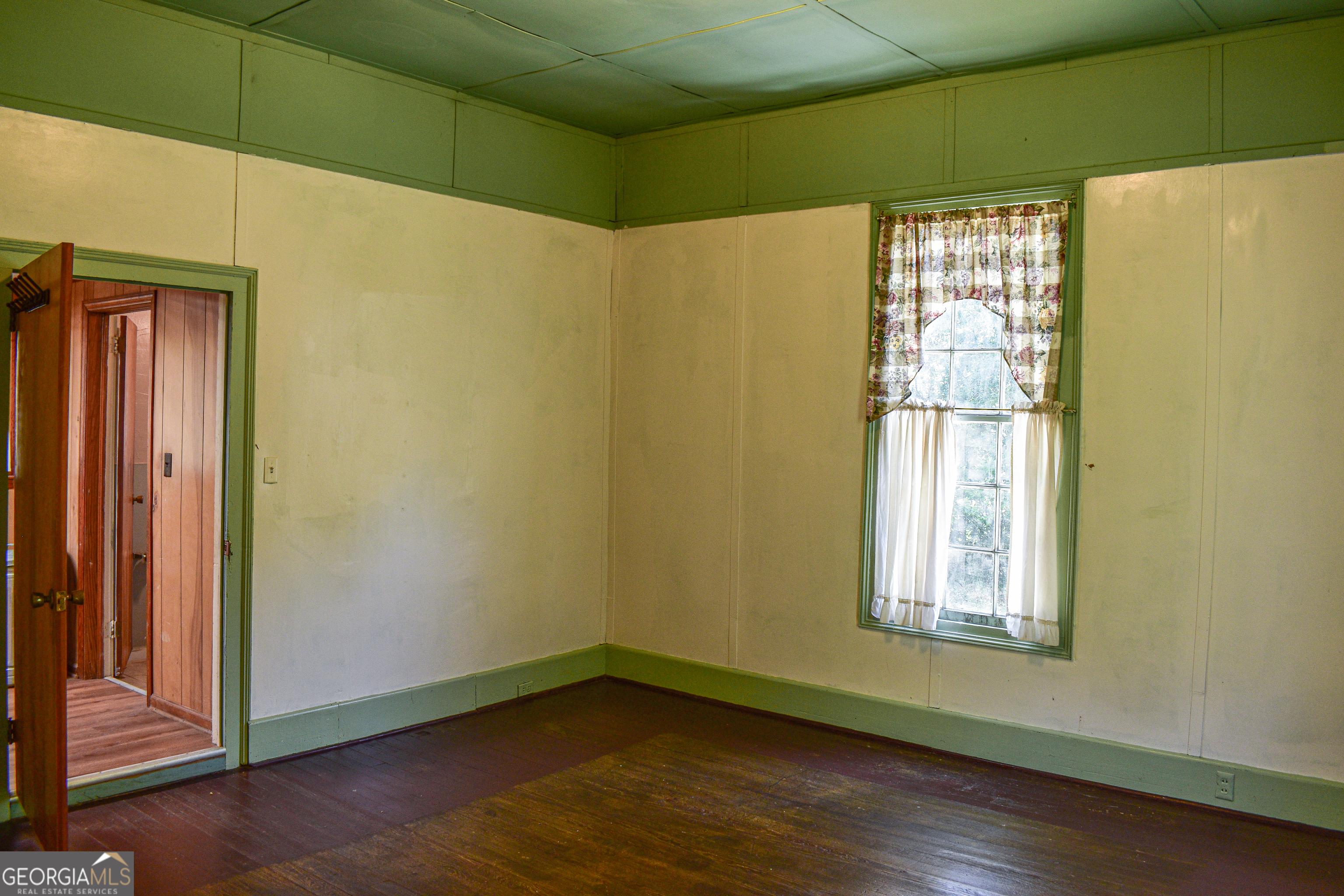 100 Minor Avenue Montezuma, GA 31063 - Photo 22 of 43 a view of a small space with wooden floor and a window