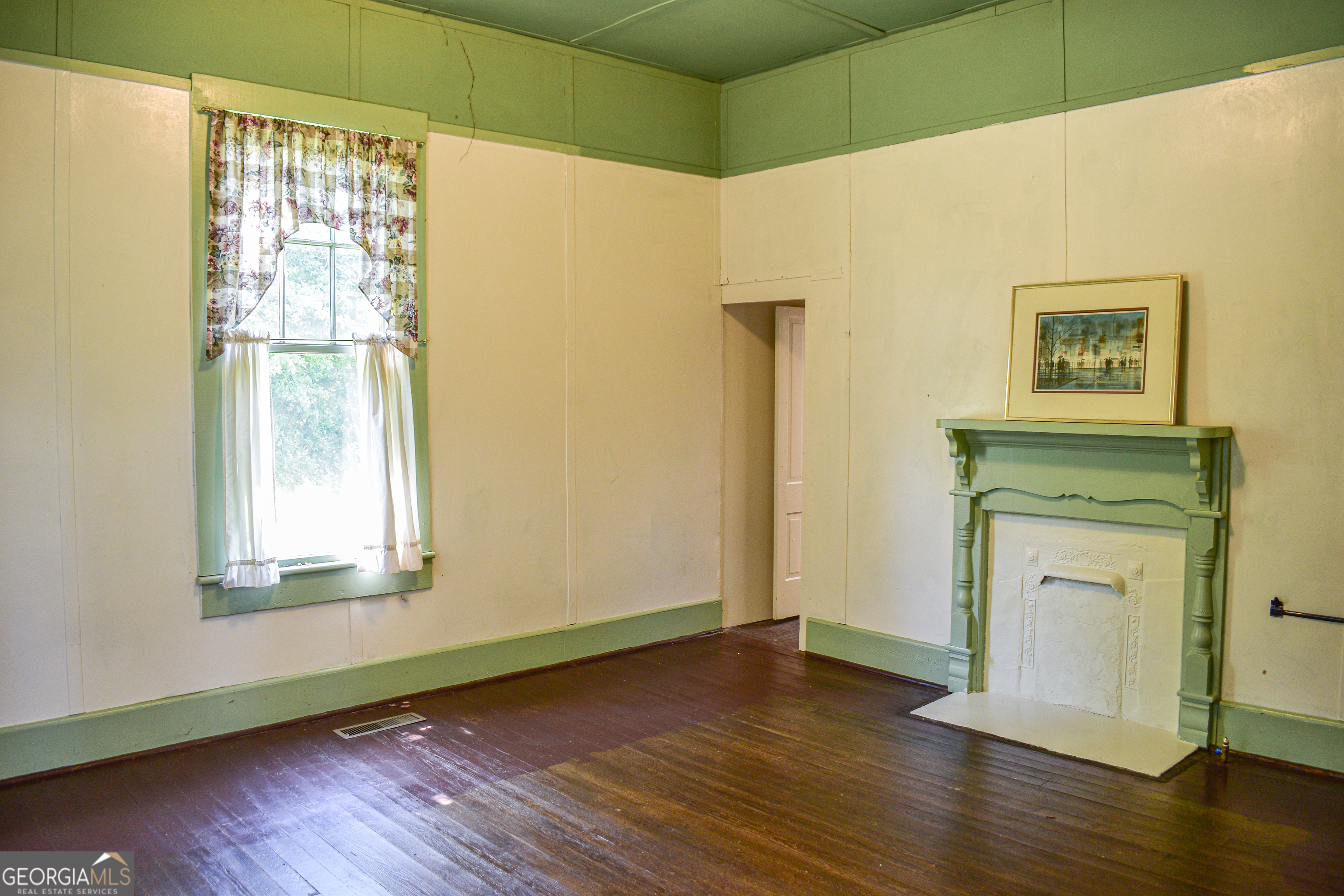100 Minor Avenue Montezuma, GA 31063 - Photo 23 of 43 a view of a small space with wooden floor and a window