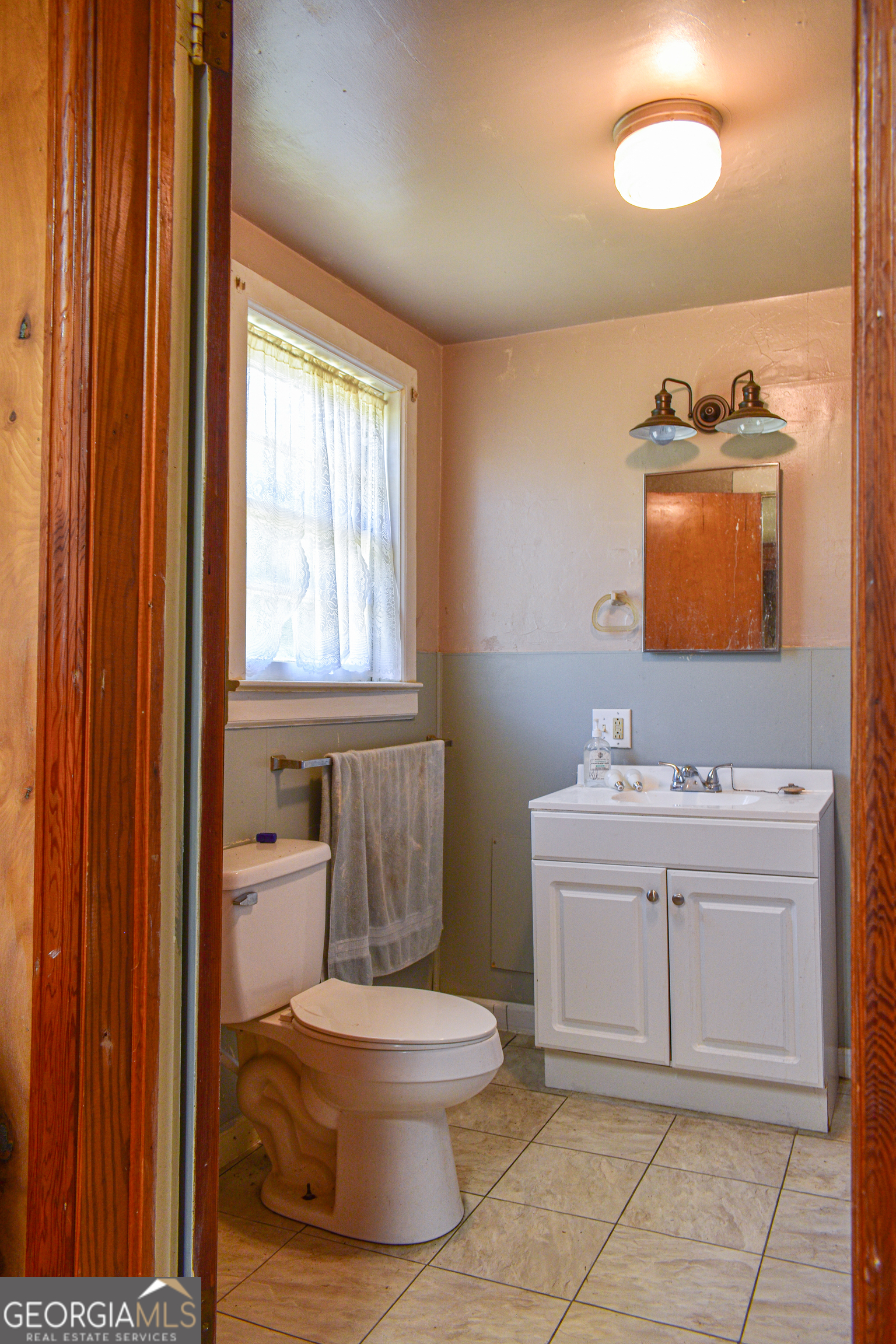 100 Minor Avenue Montezuma, GA 31063 - Photo 26 of 43 a bathroom with a toilet sink and mirror