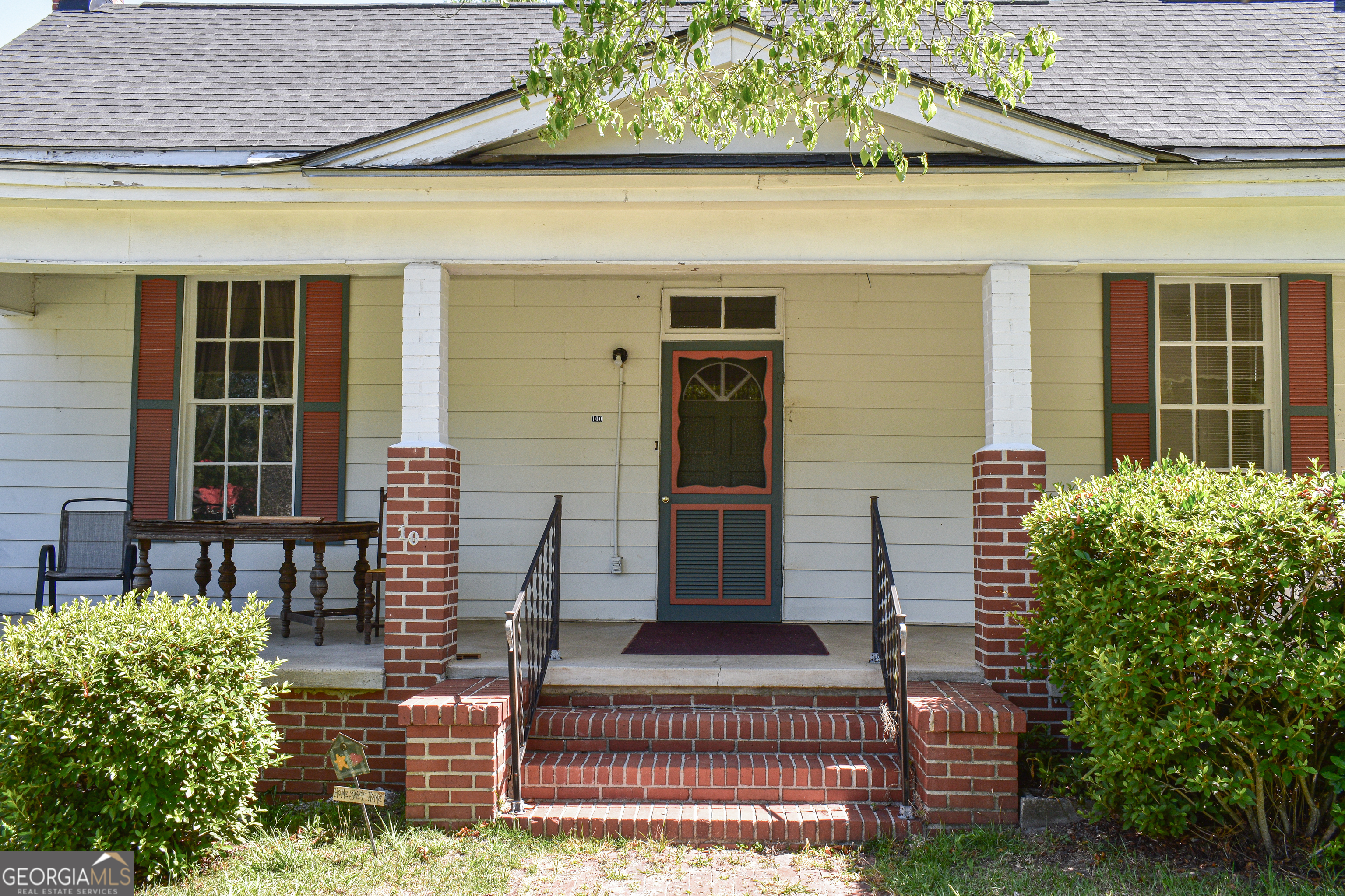 100 Minor Avenue Montezuma, GA 31063 - Photo 3 of 43 a front view of a house having patio