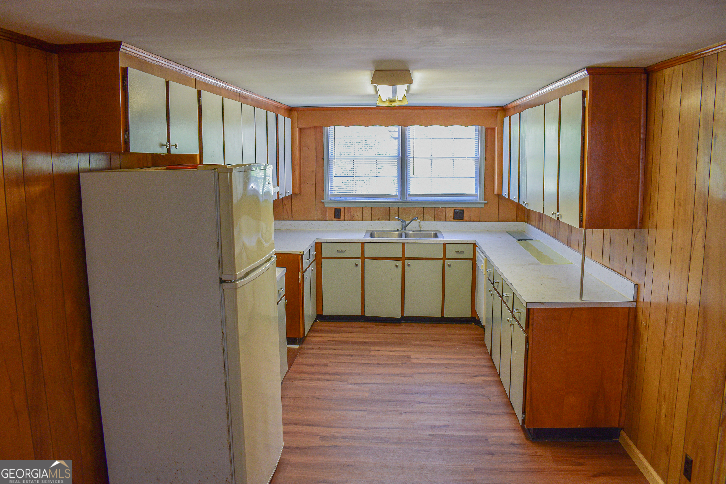 100 Minor Avenue Montezuma, GA 31063 - Photo 33 of 43 a kitchen with stainless steel appliances a refrigerator sink and cabinets
