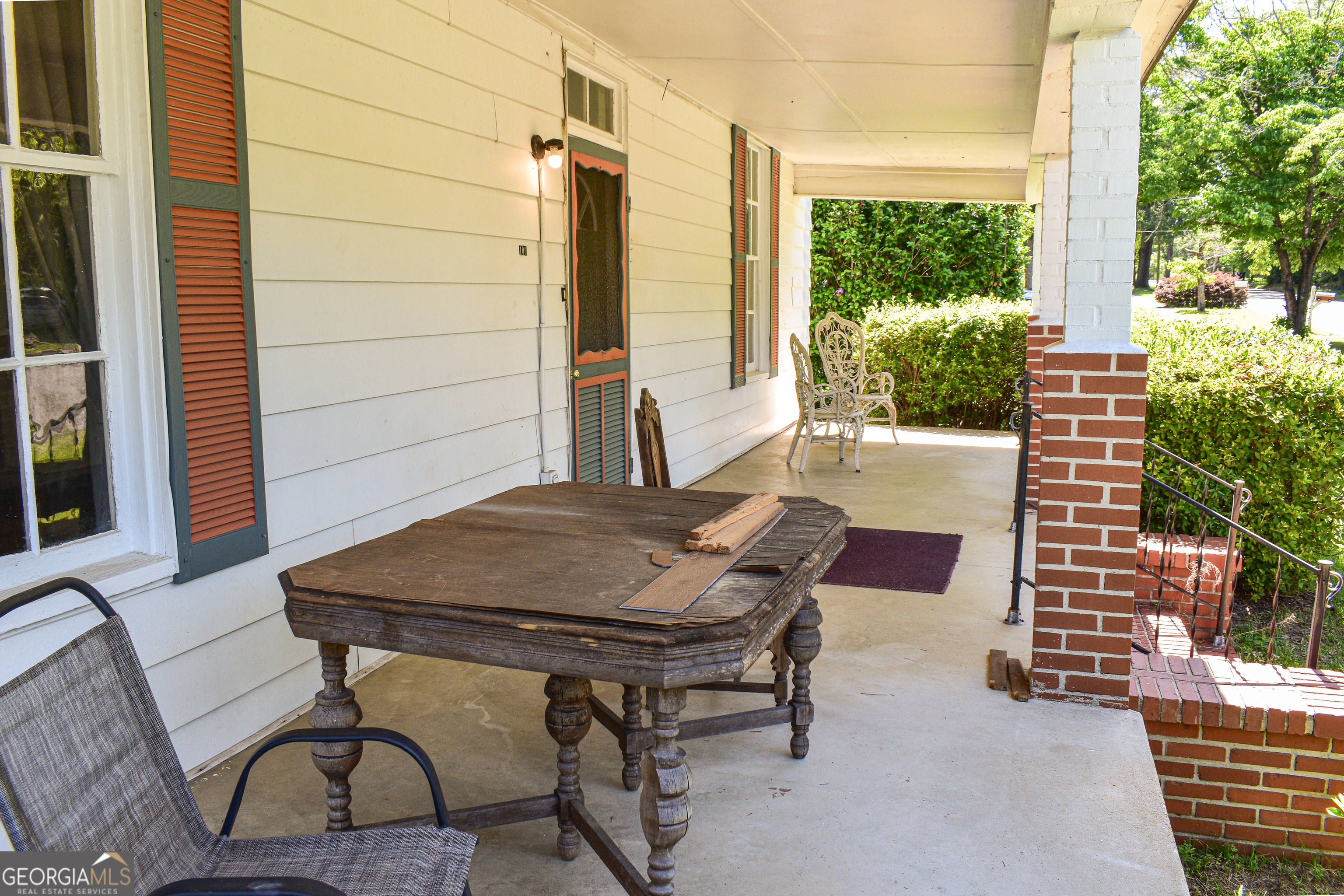 100 Minor Avenue Montezuma, GA 31063 - Photo 39 of 43 a backyard of a house with table and chairs