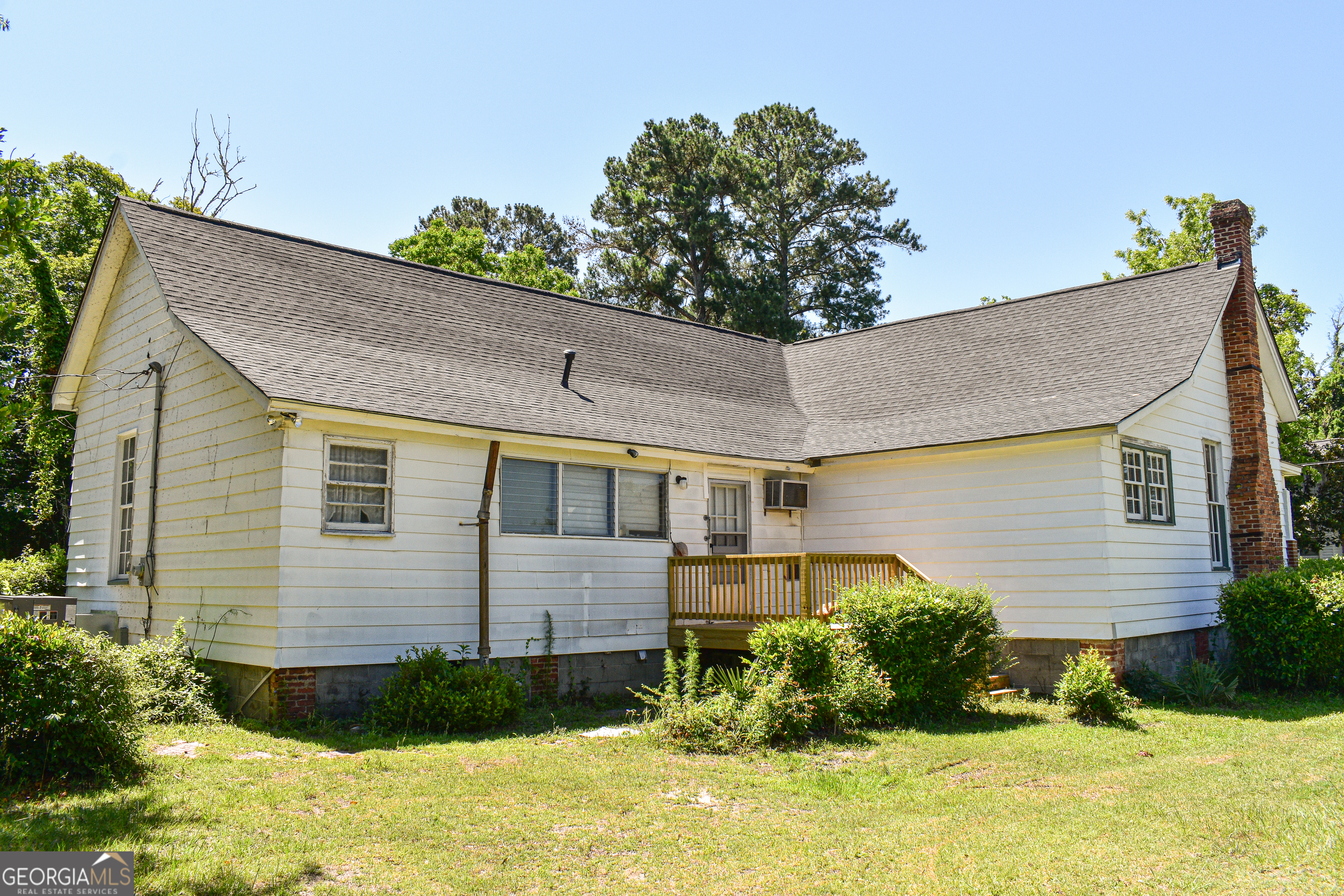 100 Minor Avenue Montezuma, GA 31063 - Photo 42 of 43 a front view of a house with garden