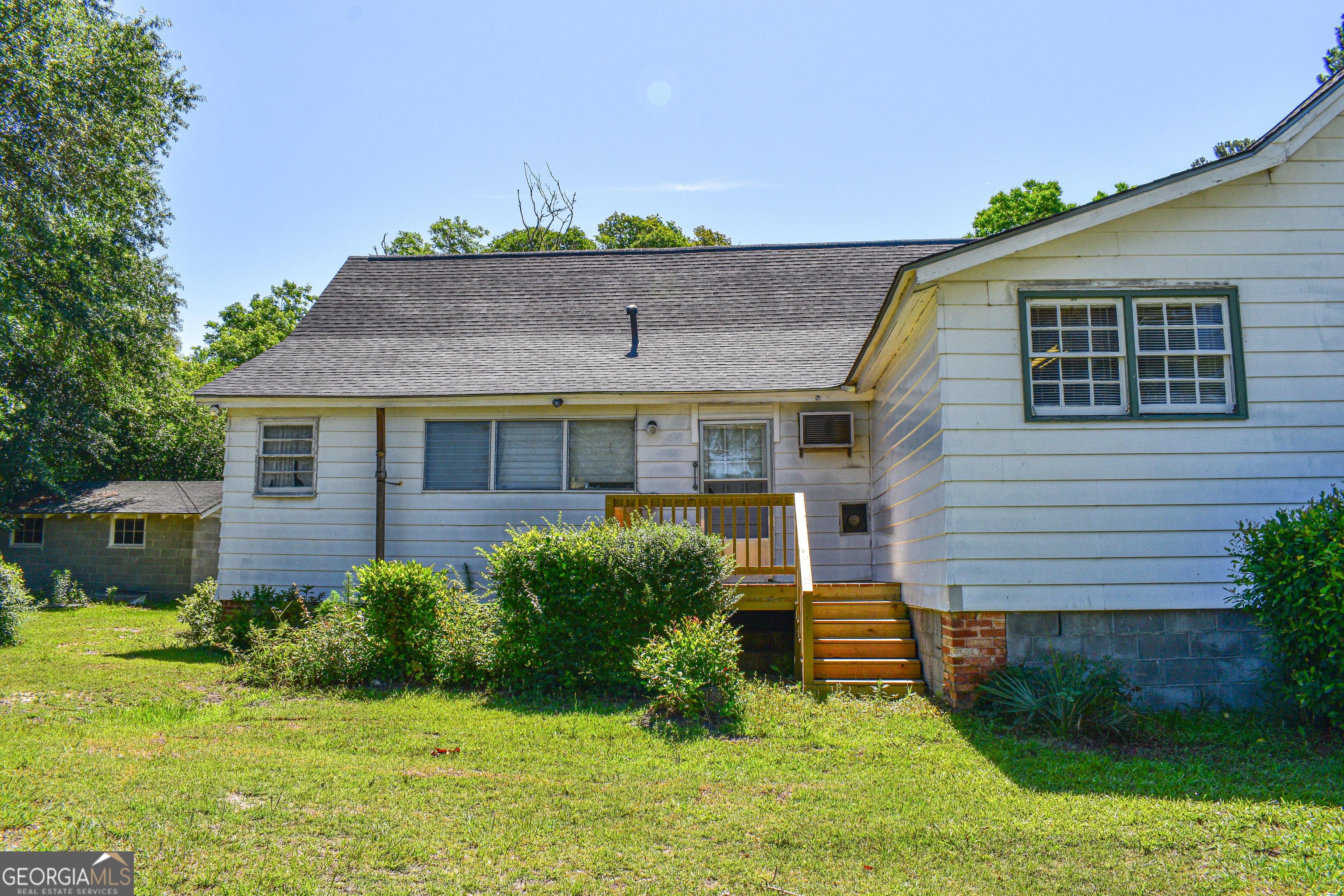 100 Minor Avenue Montezuma, GA 31063 - Photo 8 of 43 a front view of a house with garden