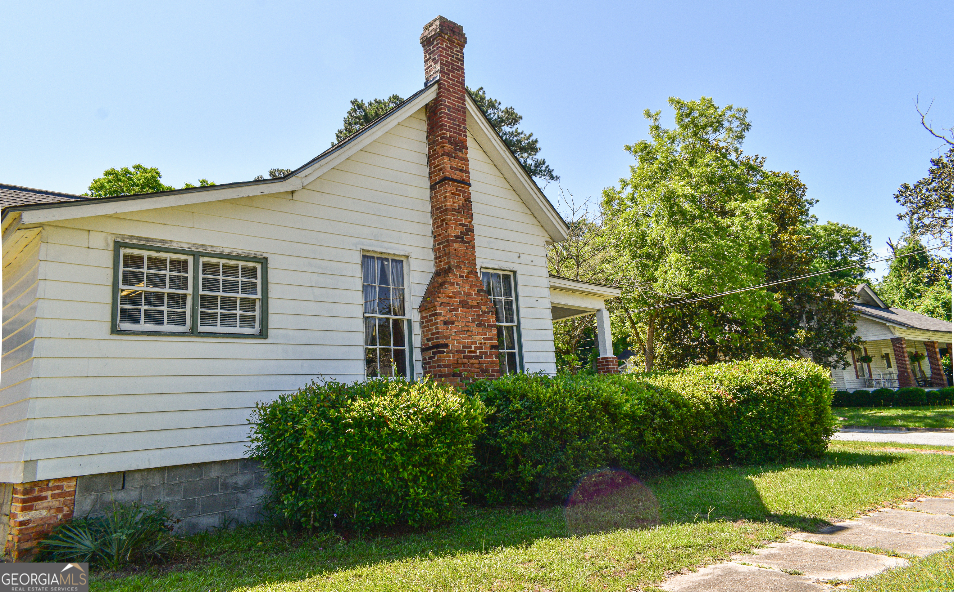 100 Minor Avenue Montezuma, GA 31063 - Photo 9 of 43 a view of a house with a yard