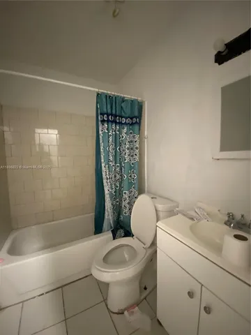 a bedroom with a bed and a closet