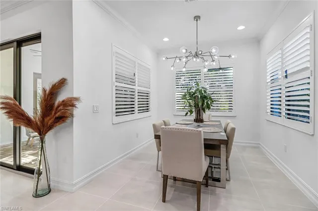 a kitchen with stainless steel appliances kitchen island granite countertop a sink stove and cabinets