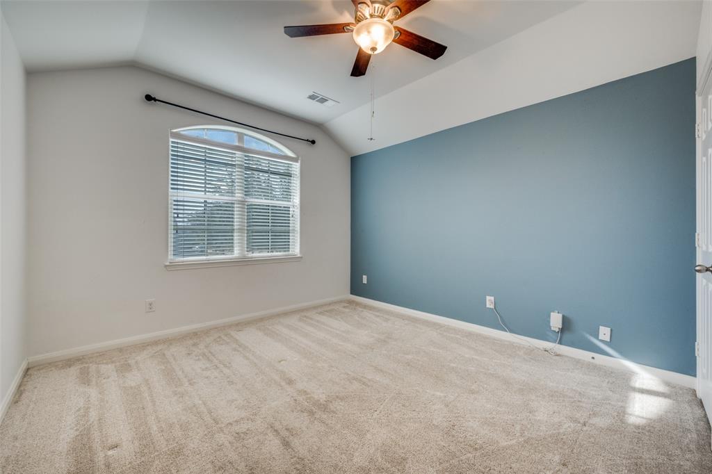 2813 Joshua Street Denton, TX 76209 - Photo 11 of 17 an empty room with a window and a fan
