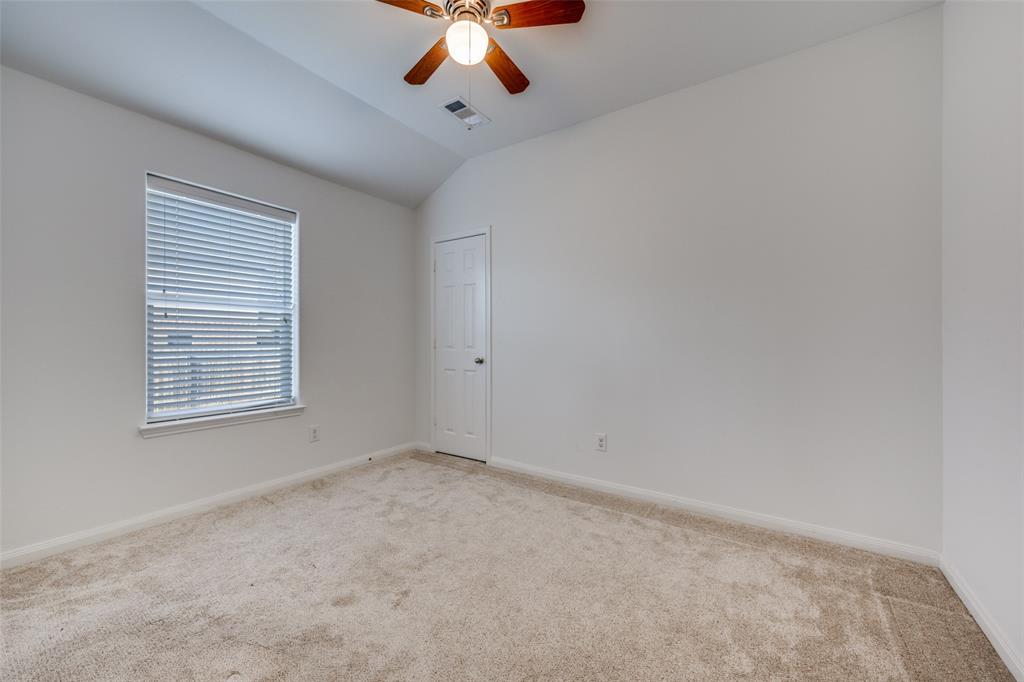 2813 Joshua Street Denton, TX 76209 - Photo 14 of 17 a view of an empty room with a window