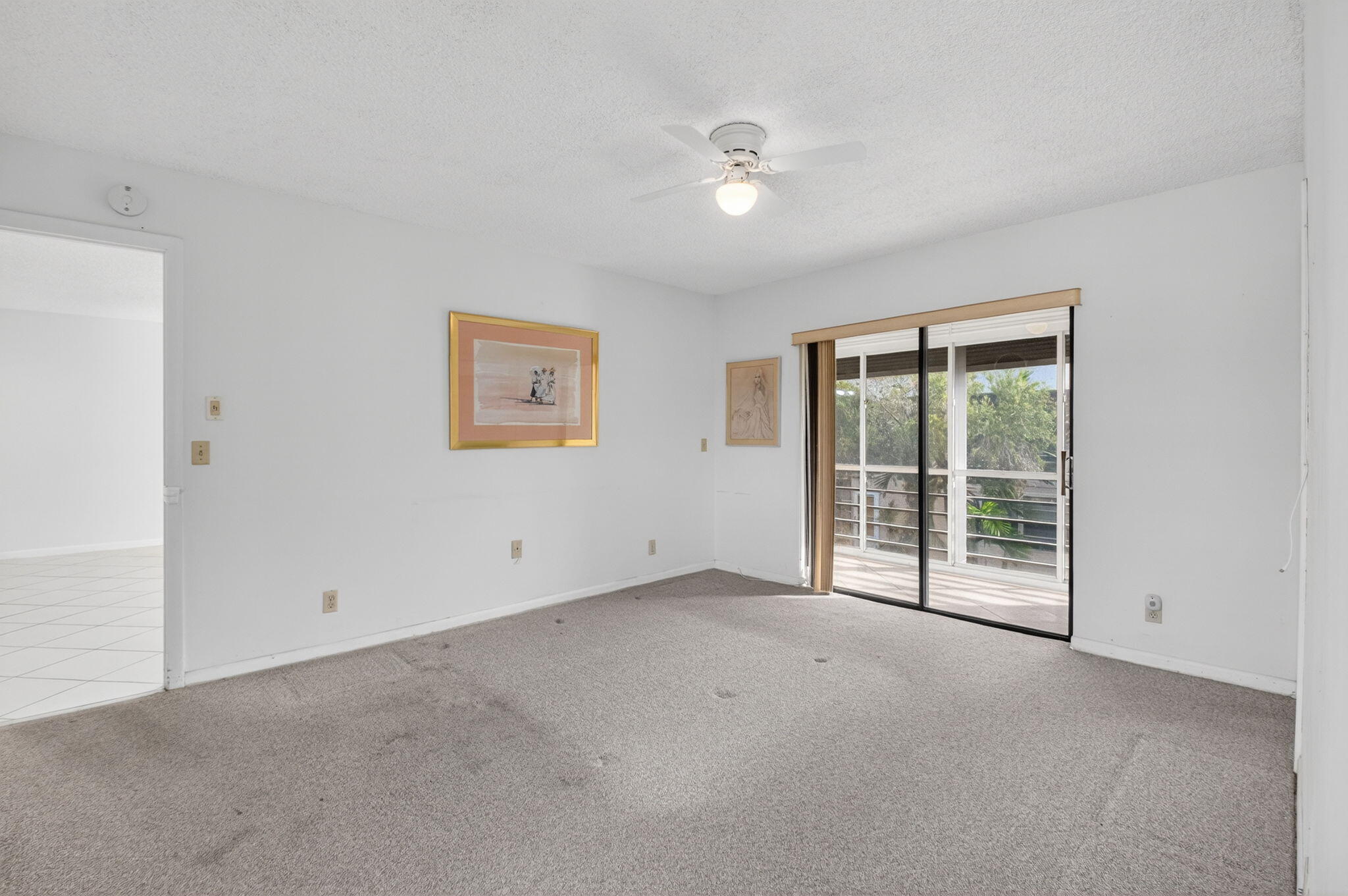 136 Capri B Delray Beach, FL 33484 - Photo 13 of 42 a view of an empty room with a window