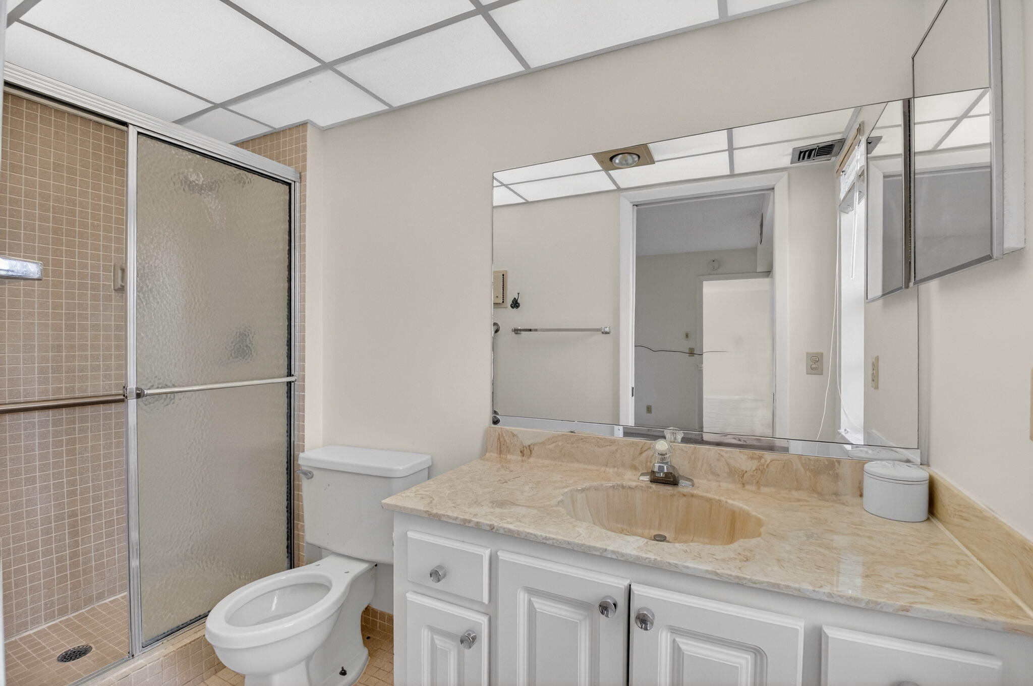 136 Capri B Delray Beach, FL 33484 - Photo 15 of 42 a bathroom with a granite countertop sink toilet and shower