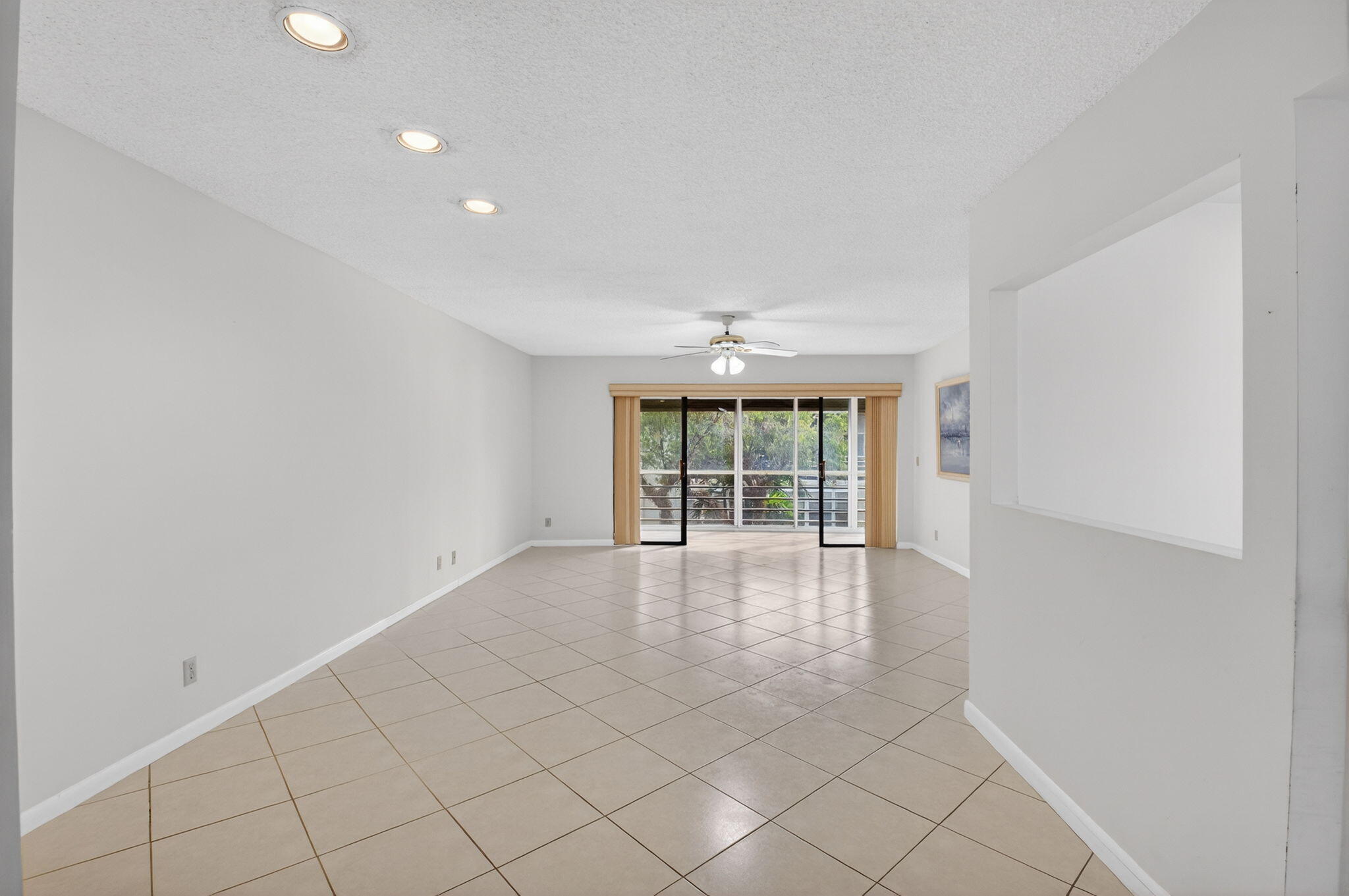 136 Capri B Delray Beach, FL 33484 - Photo 4 of 42 wooden floor in an empty room with a window
