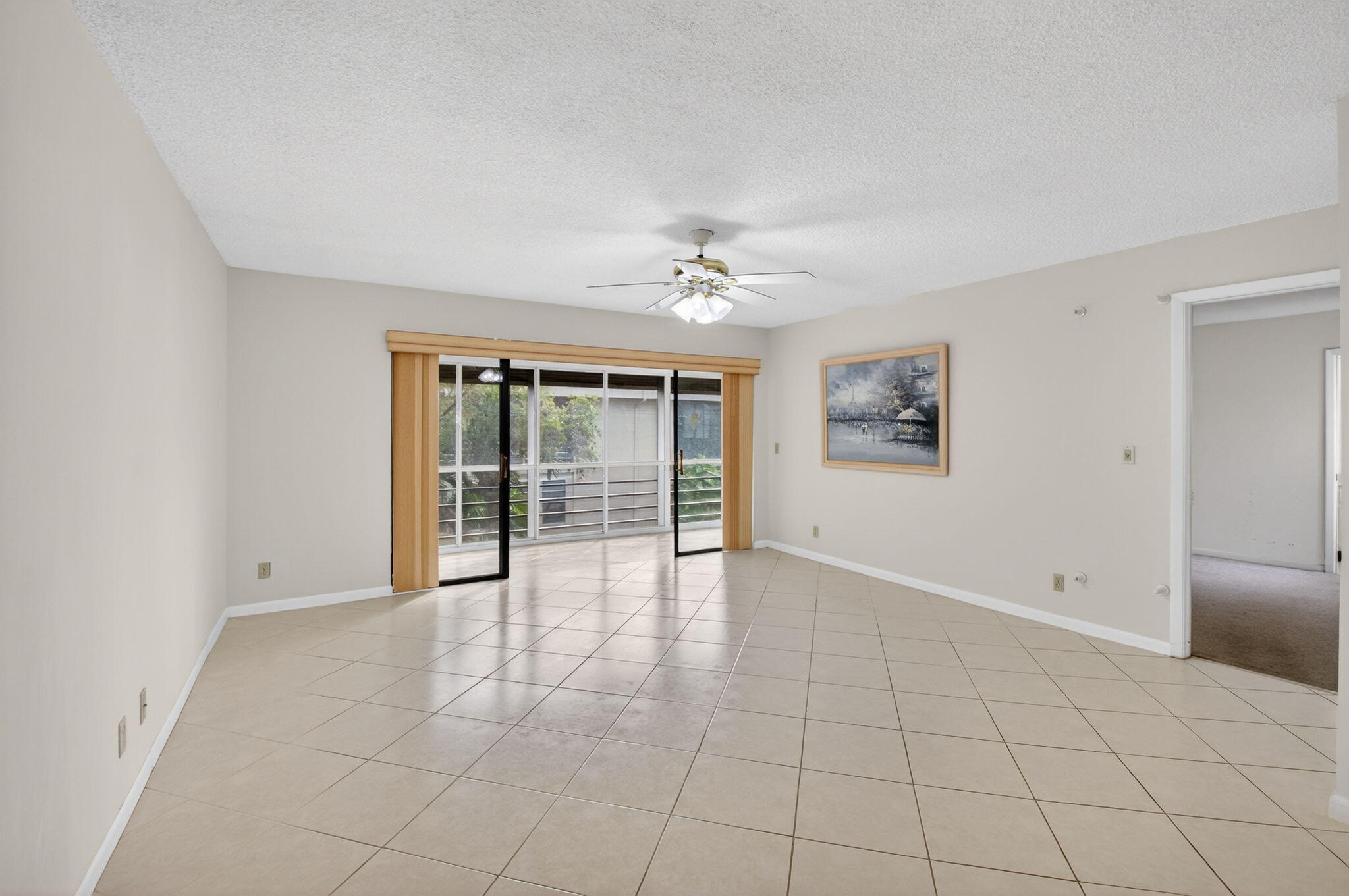 136 Capri B Delray Beach, FL 33484 - Photo 6 of 42 a view of an empty room with a window