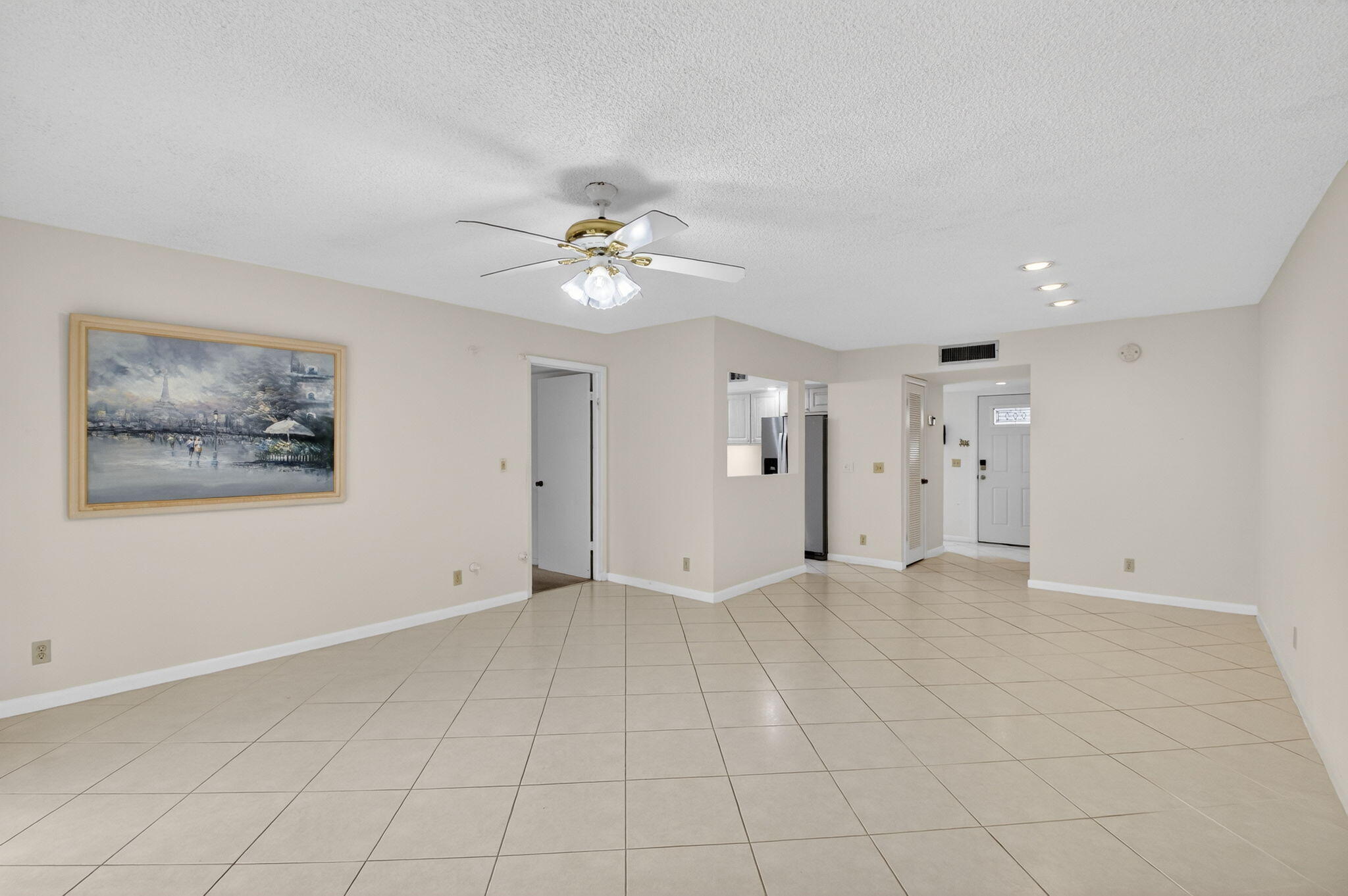 136 Capri B Delray Beach, FL 33484 - Photo 7 of 42 a view of an empty room with a window