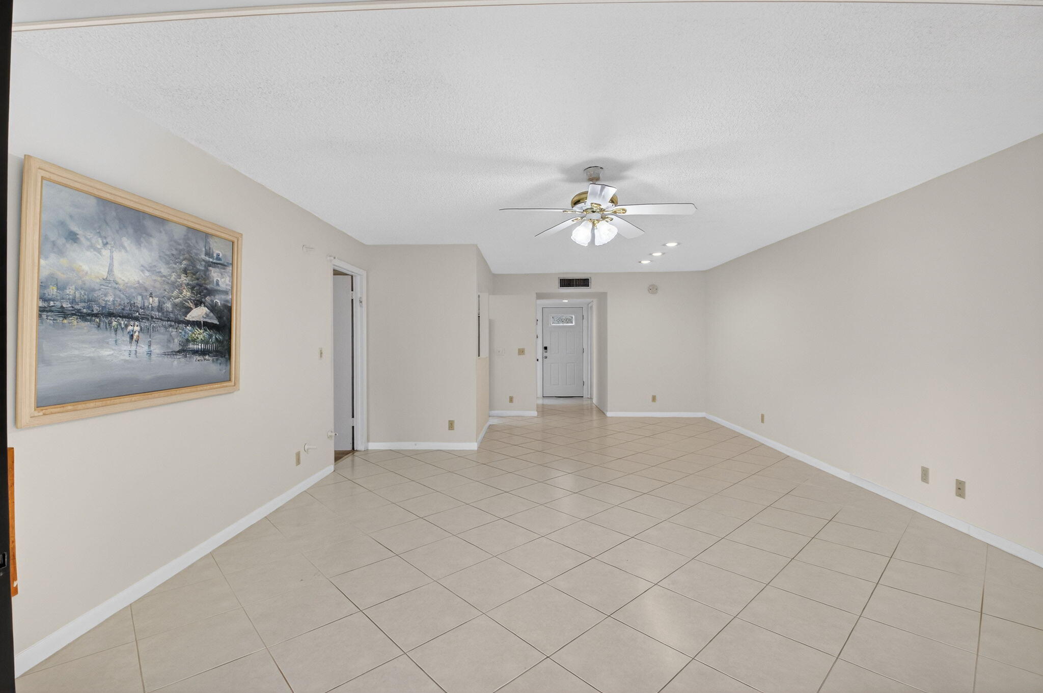 136 Capri B Delray Beach, FL 33484 - Photo 8 of 42 a view of an empty room with a fan
