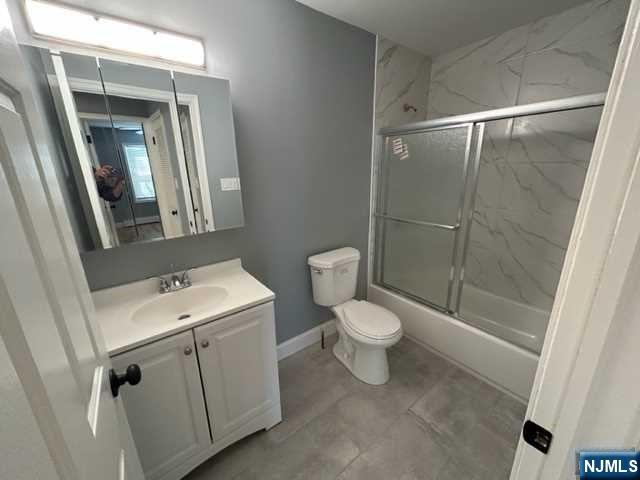 47 Ann Street, Unit 1 Paterson, NJ 07501 - Photo 15 of 20 a bathroom with a sink a toilet and shower