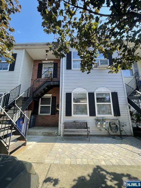 47 Ann Street, Unit 1 Paterson, NJ 07501 - Photo 2 of 20 a front view of a house with a yard