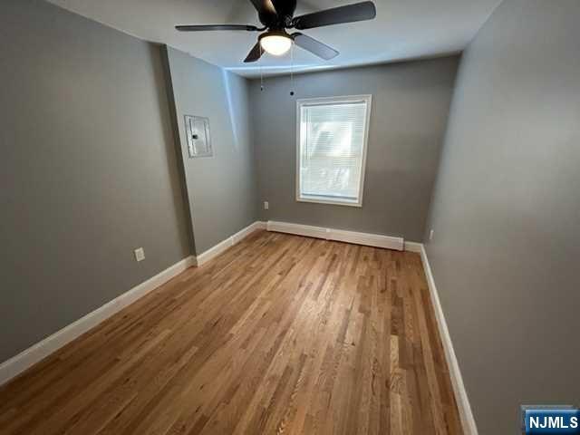 47 Ann Street, Unit 1 Paterson, NJ 07501 - Photo 9 of 20 wooden floor in an empty room with a window