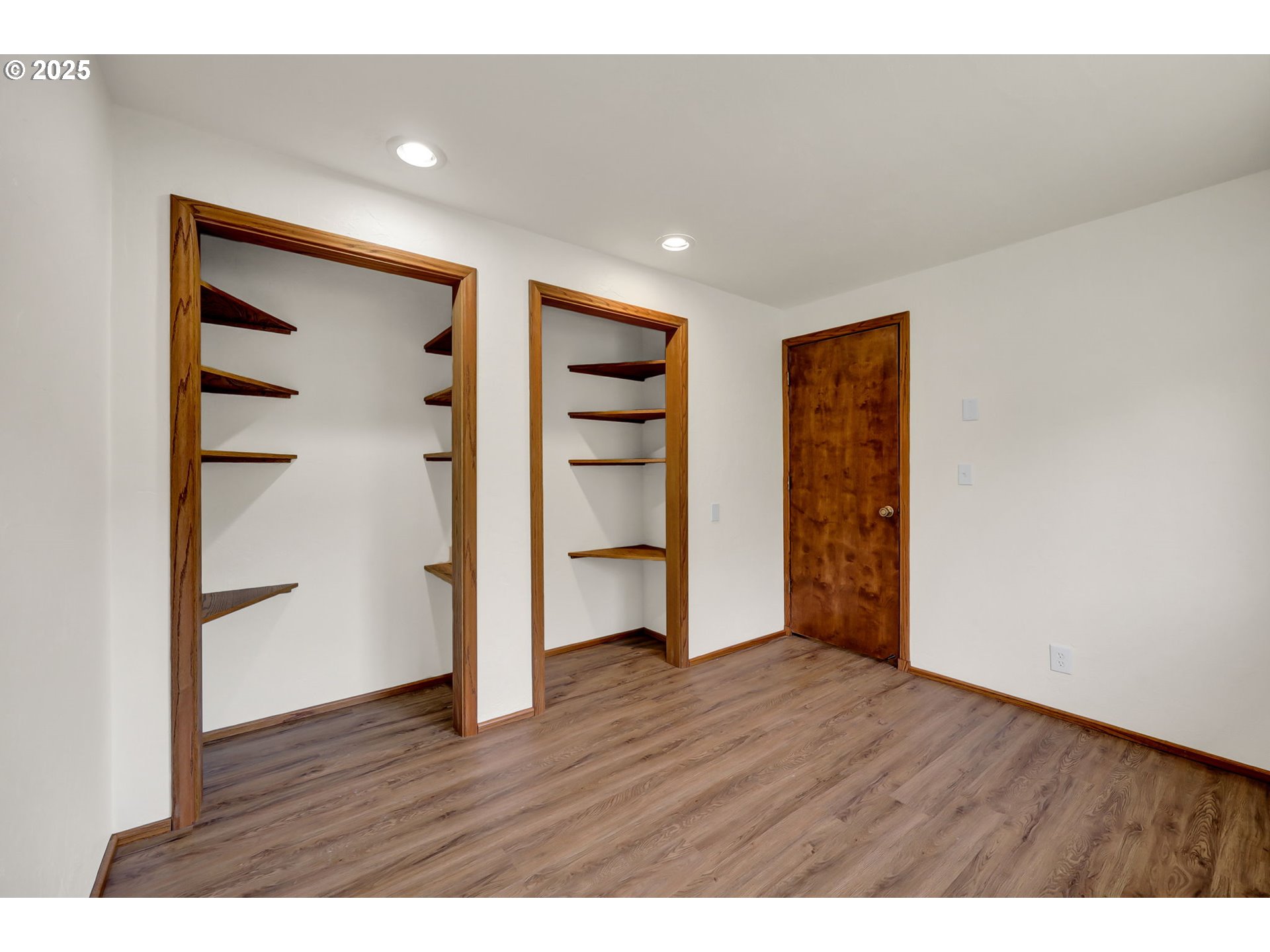 7087 Aster Street Springfield, OR 97478 - Photo 23 of 46 a view of an empty room with a window and wooden floor
