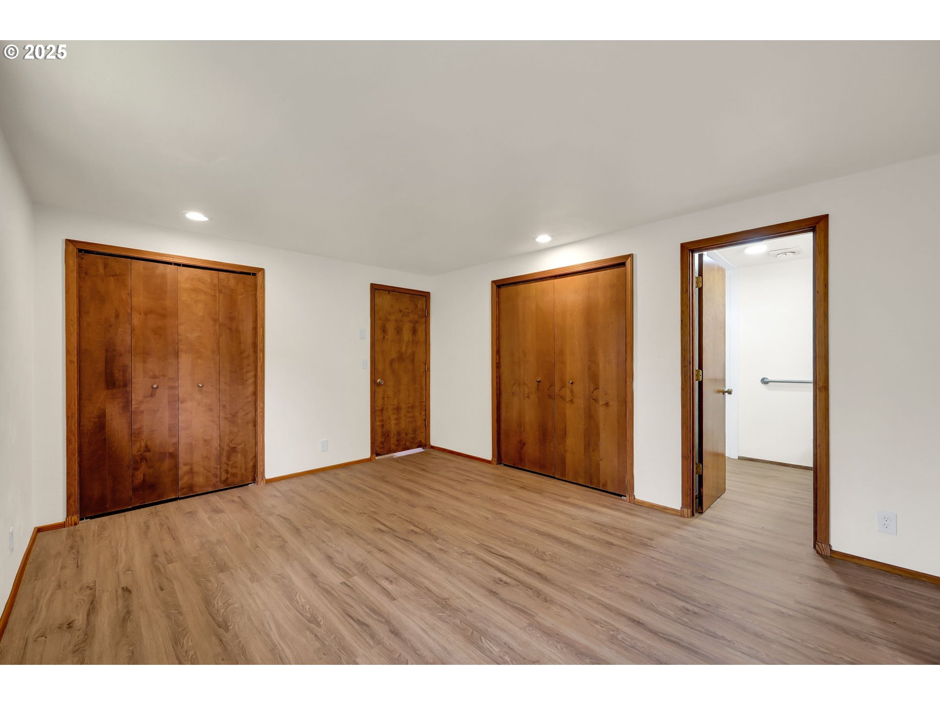 7087 Aster Street Springfield, OR 97478 - Photo 27 of 46 a view of an empty room with wooden floor and closet