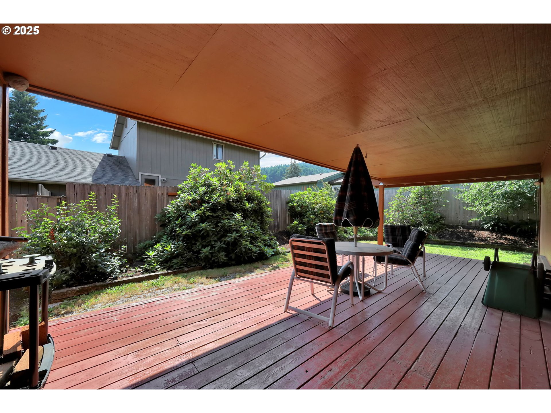 7087 Aster Street Springfield, OR 97478 - Photo 33 of 46 a view of a chairs and table on the wooden deck