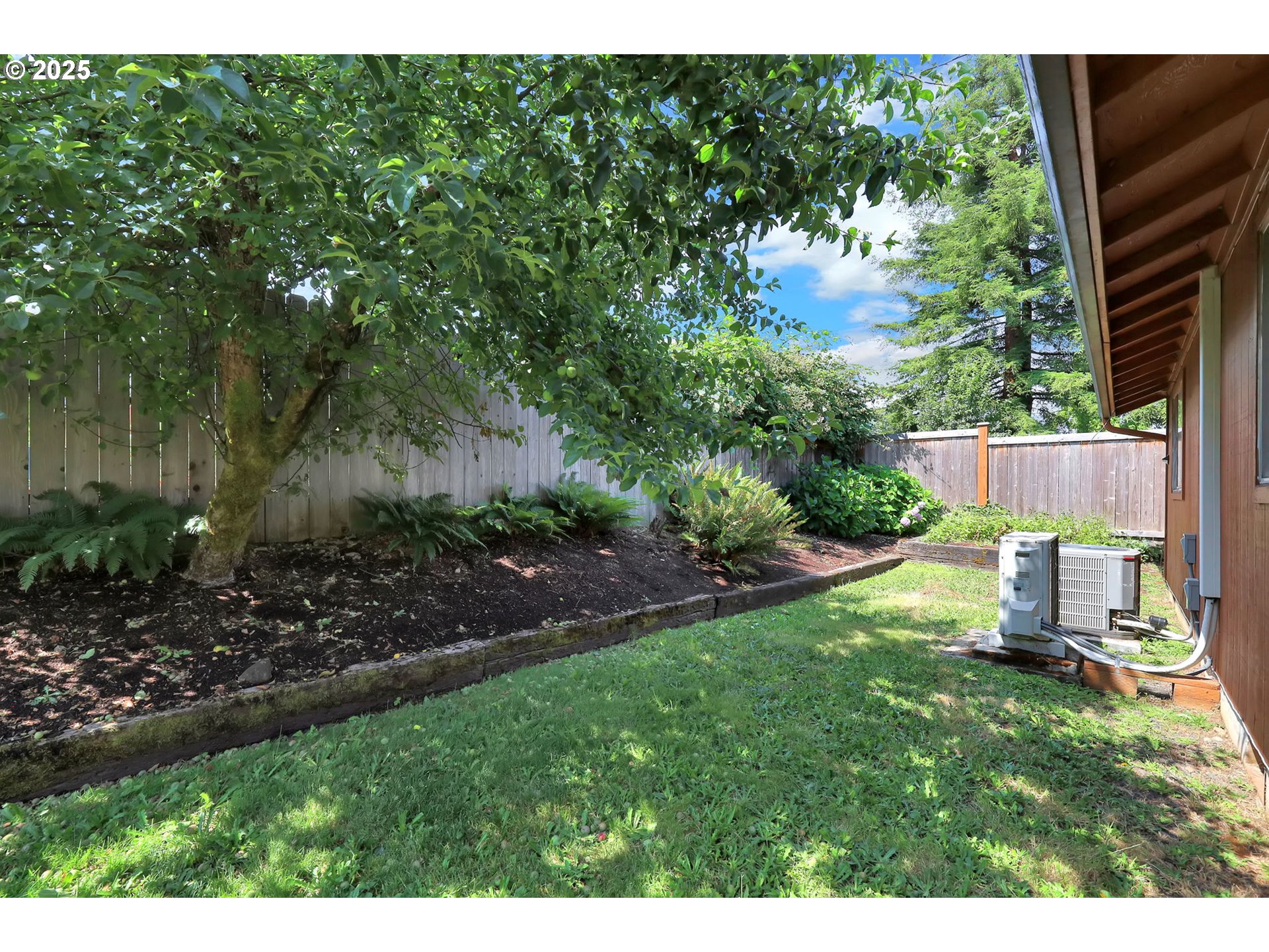 7087 Aster Street Springfield, OR 97478 - Photo 38 of 46 a view of a chair and table in backyard of the house