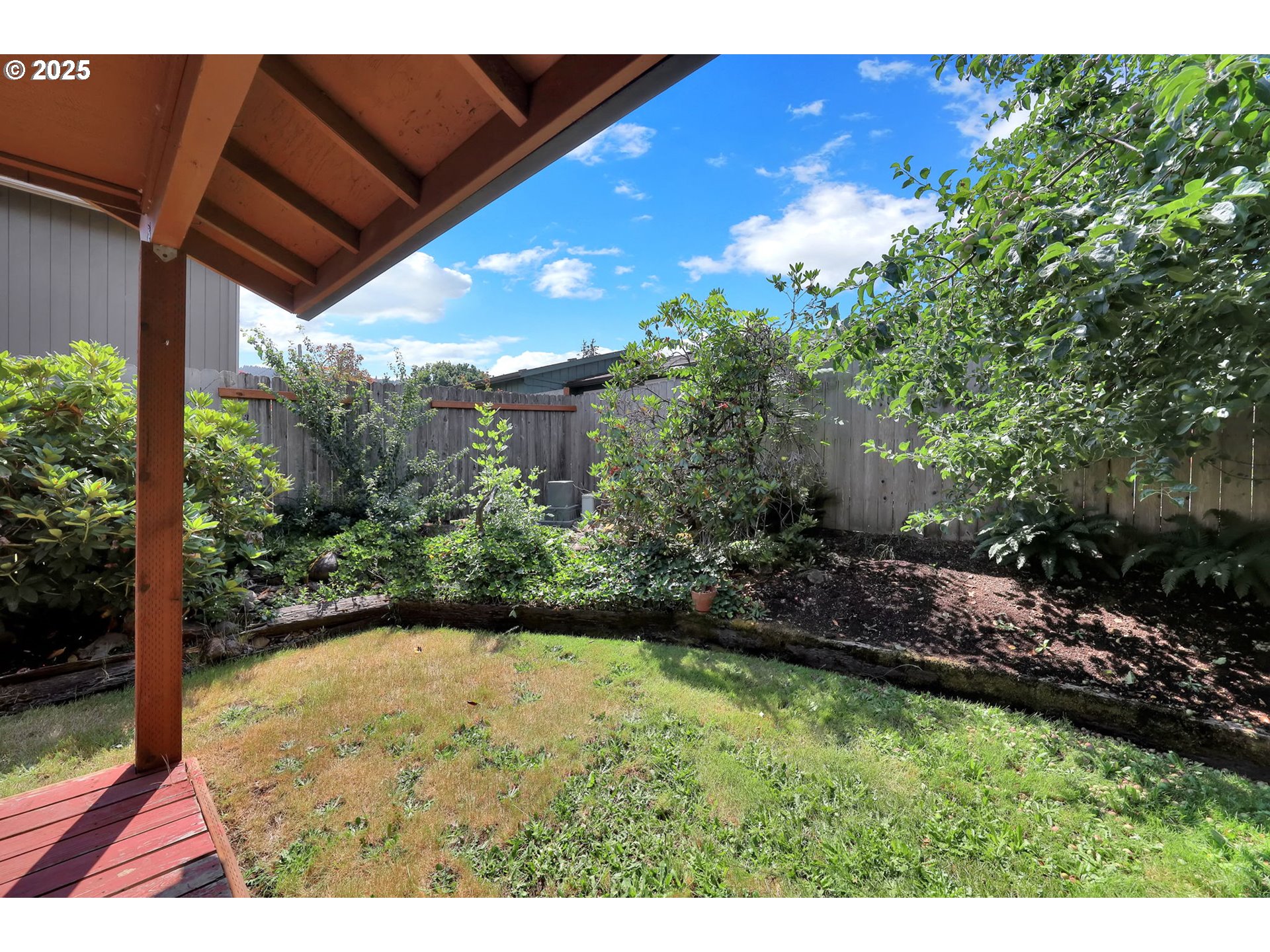 7087 Aster Street Springfield, OR 97478 - Photo 39 of 46 a view of backyard with plants and outdoor seating