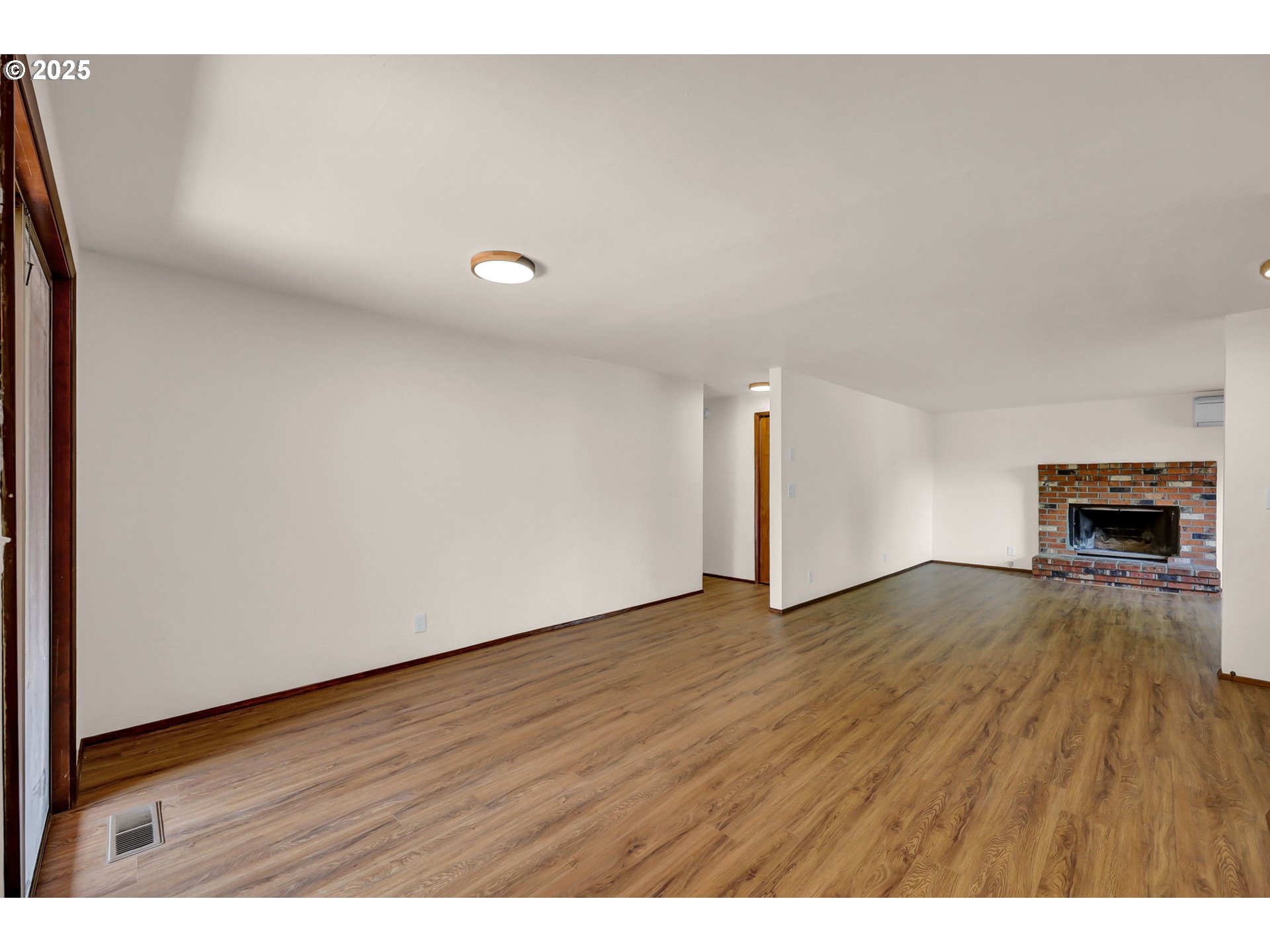 7087 Aster Street Springfield, OR 97478 - Photo 5 of 46 a view of empty room with wooden floor