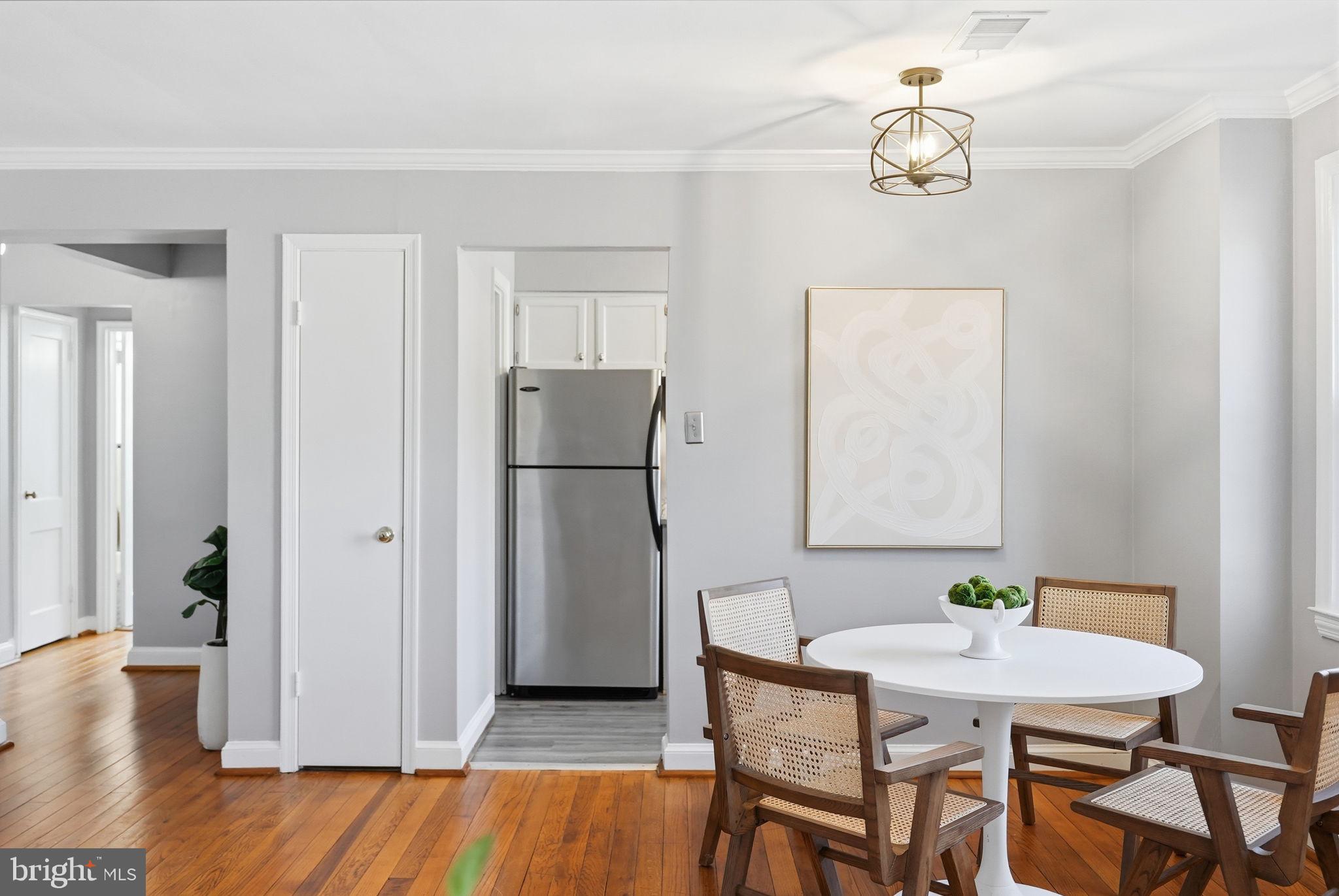 2900 13th Road South, Unit 201 Arlington, VA 22204 - Photo 12 of 32 a view of a dining room with furniture and wooden floor