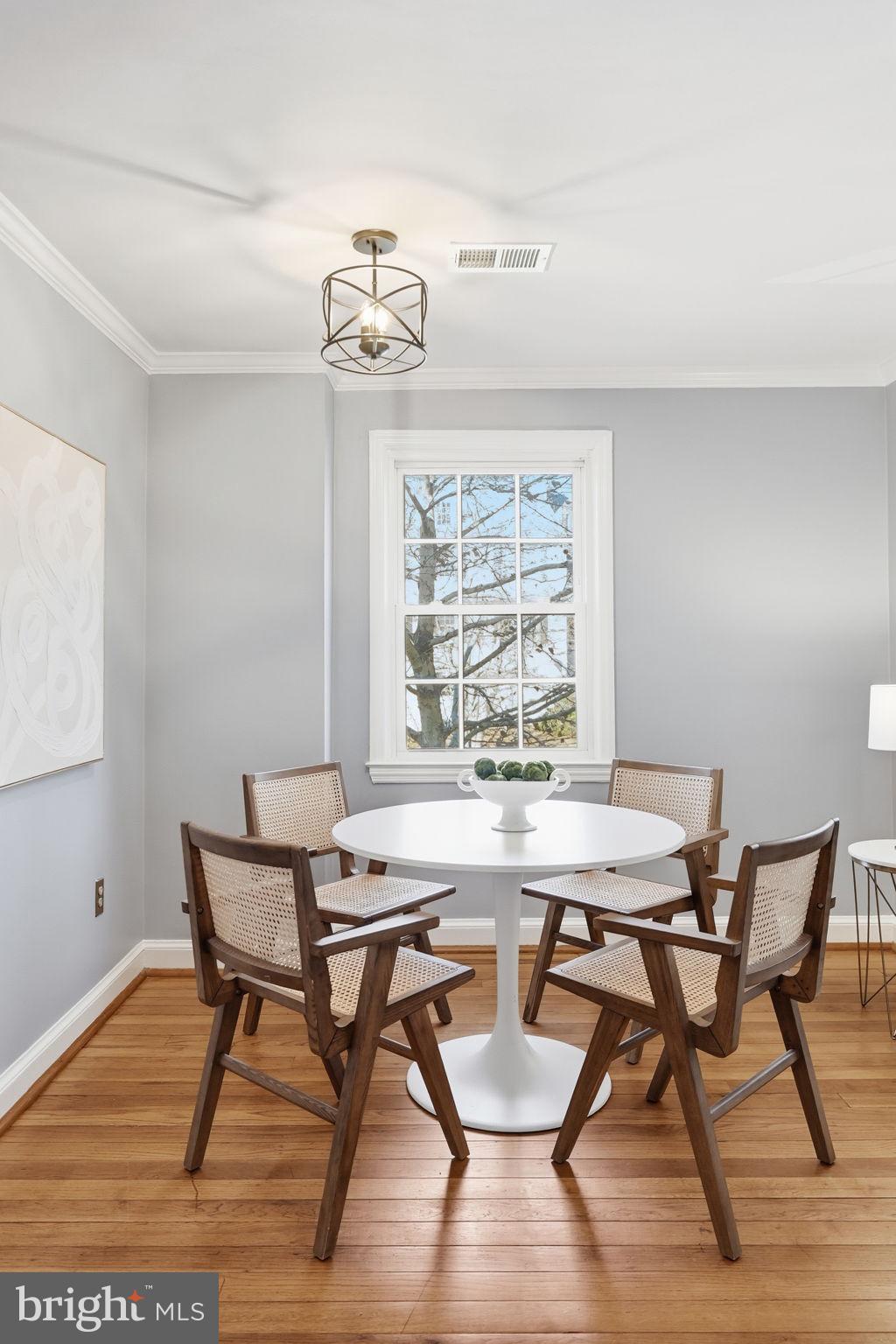 2900 13th Road South, Unit 201 Arlington, VA 22204 - Photo 13 of 32 a view of a dining room with furniture wooden floor and a chandelier