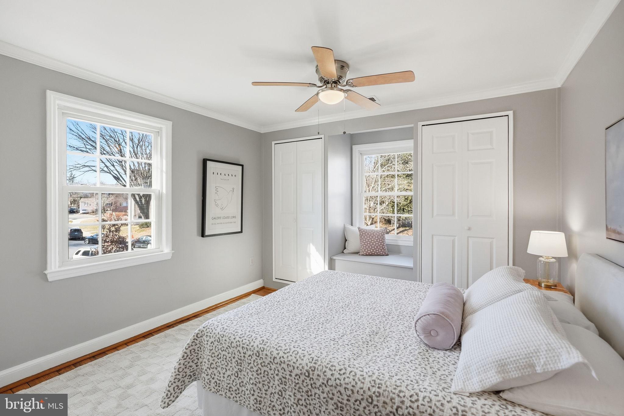 2900 13th Road South, Unit 201 Arlington, VA 22204 - Photo 17 of 32 a bedroom with a large bed and a window