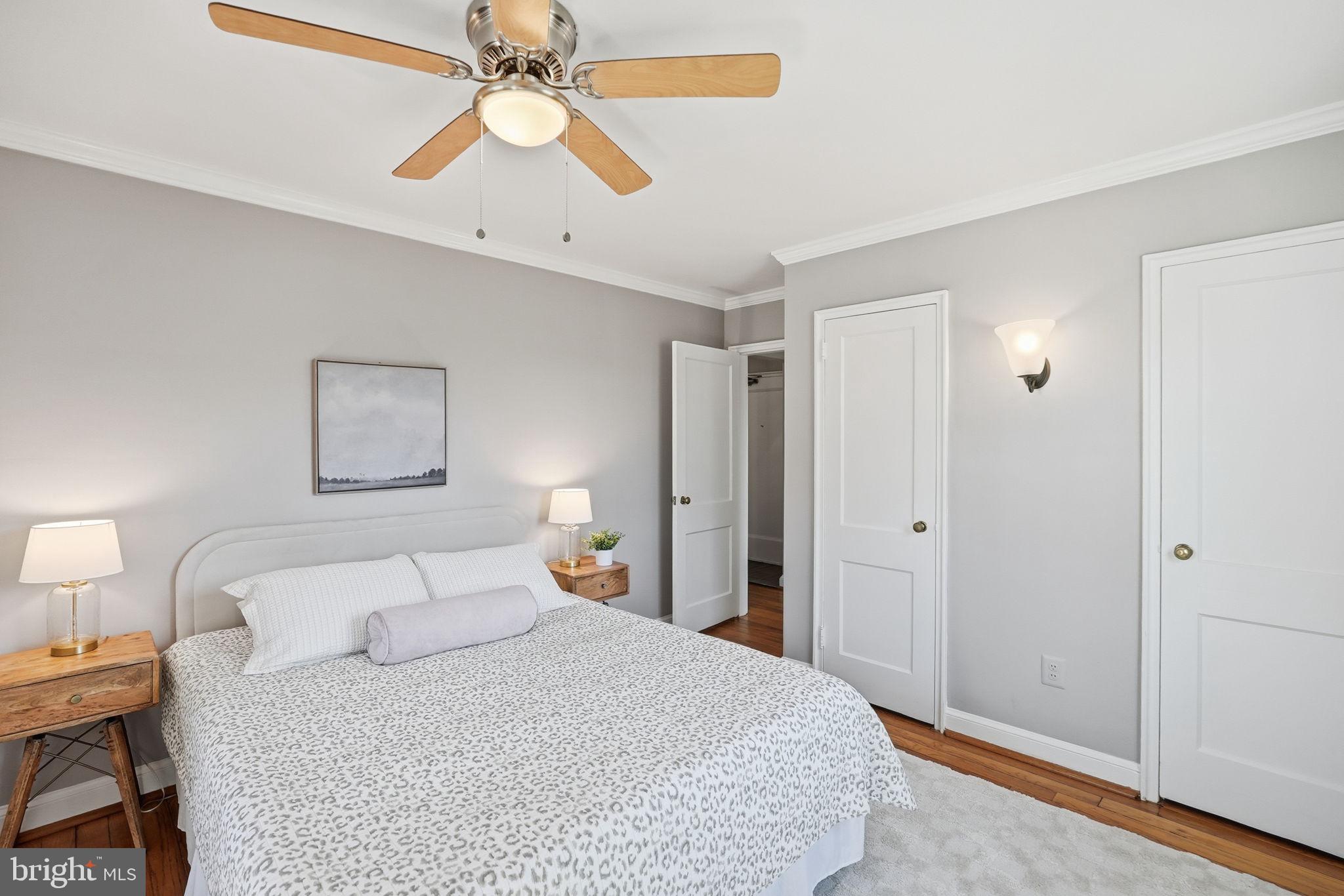 2900 13th Road South, Unit 201 Arlington, VA 22204 - Photo 19 of 32 a bedroom with a bed and a chandelier