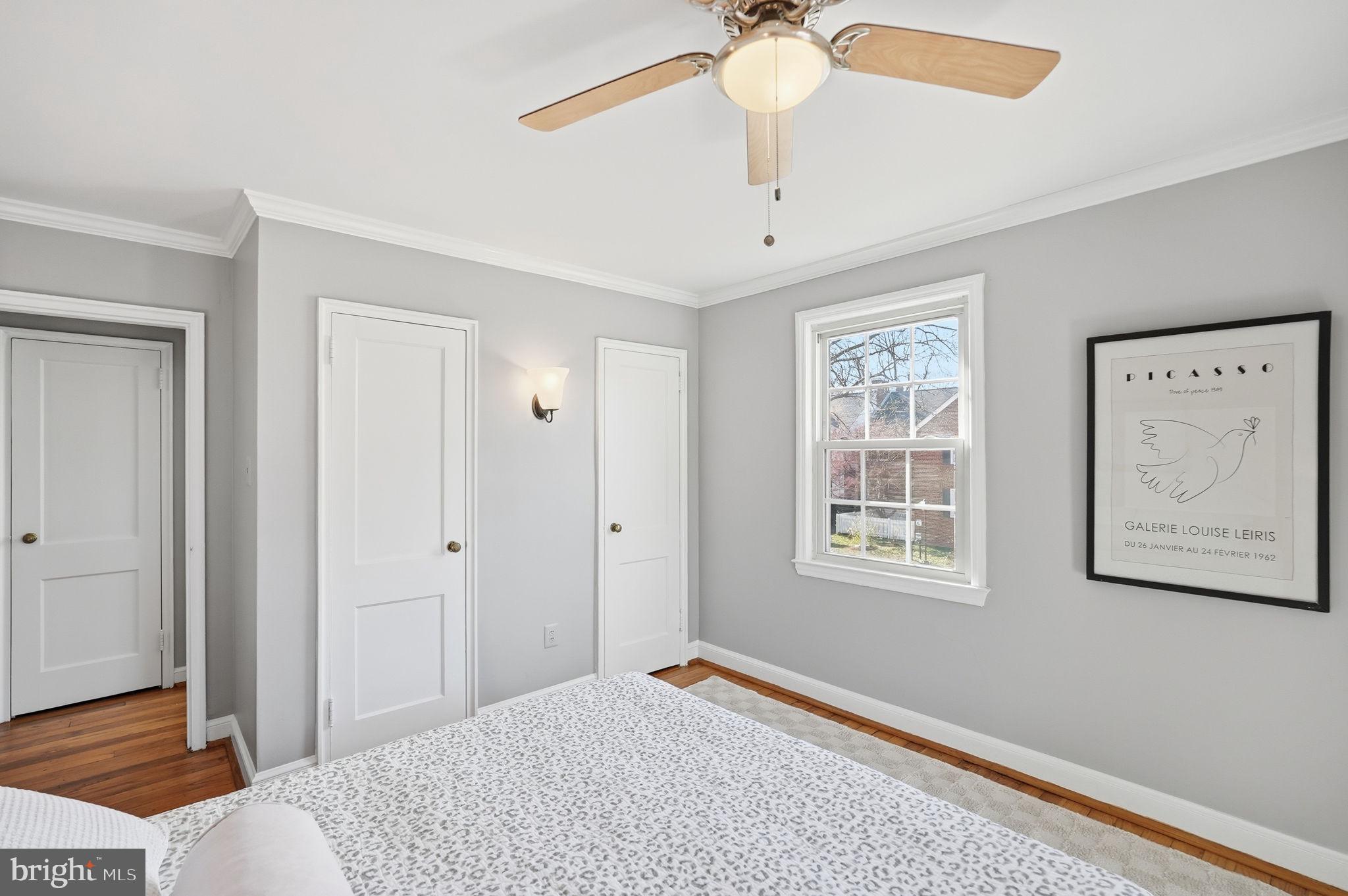 2900 13th Road South, Unit 201 Arlington, VA 22204 - Photo 20 of 32 a bedroom with a bed and a chandelier