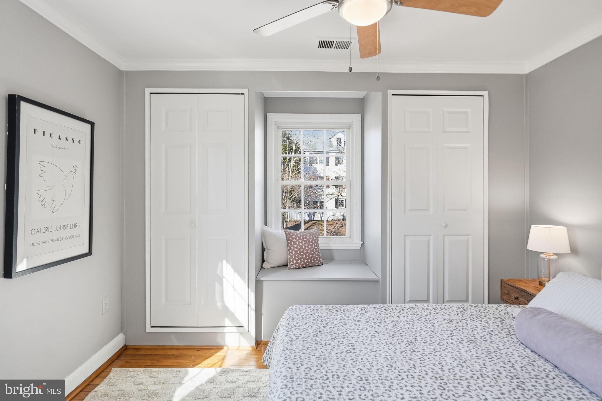 2900 13th Road South, Unit 201 Arlington, VA 22204 - Photo 21 of 32 a bedroom with a bed and wooden floor