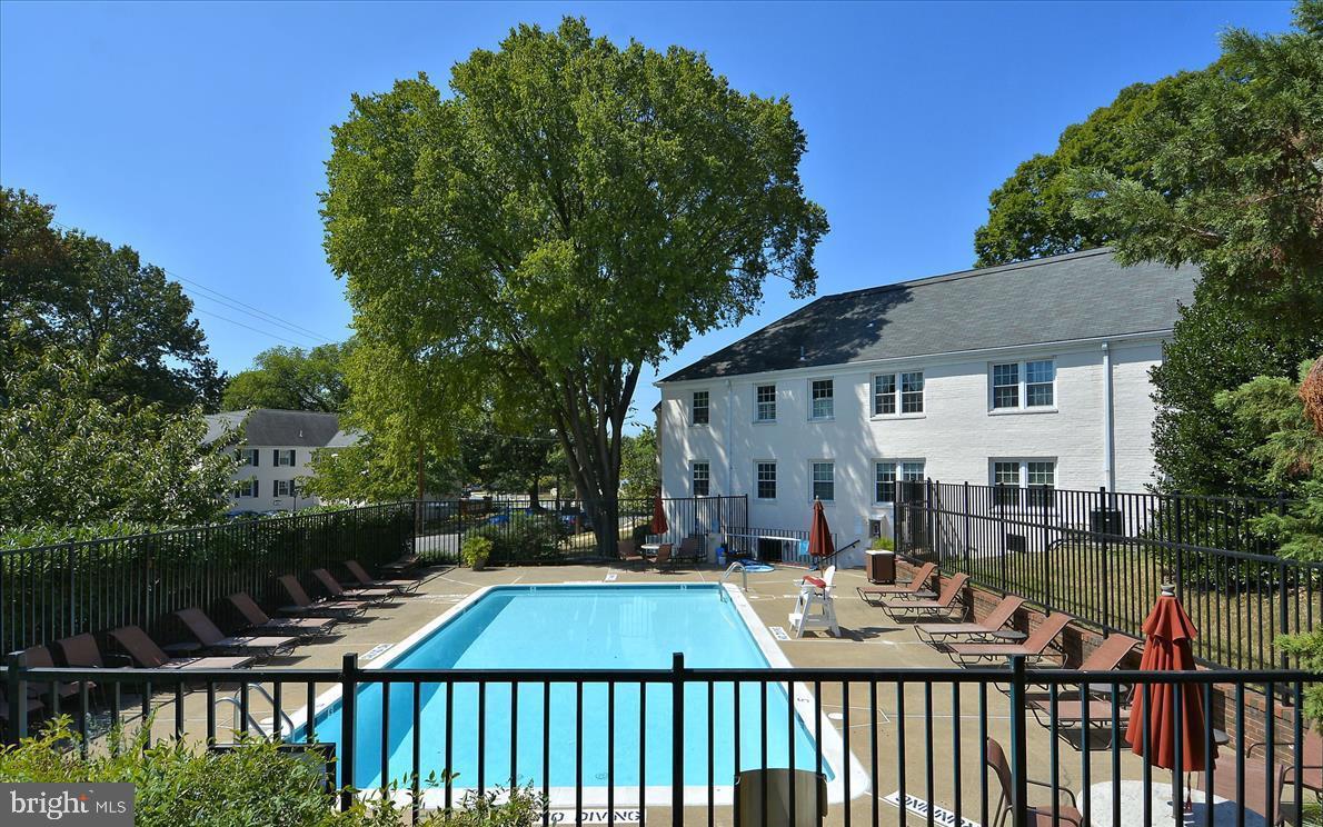 2900 13th Road South, Unit 201 Arlington, VA 22204 - Photo 25 of 32 a view of a brick house with a small yard and plants