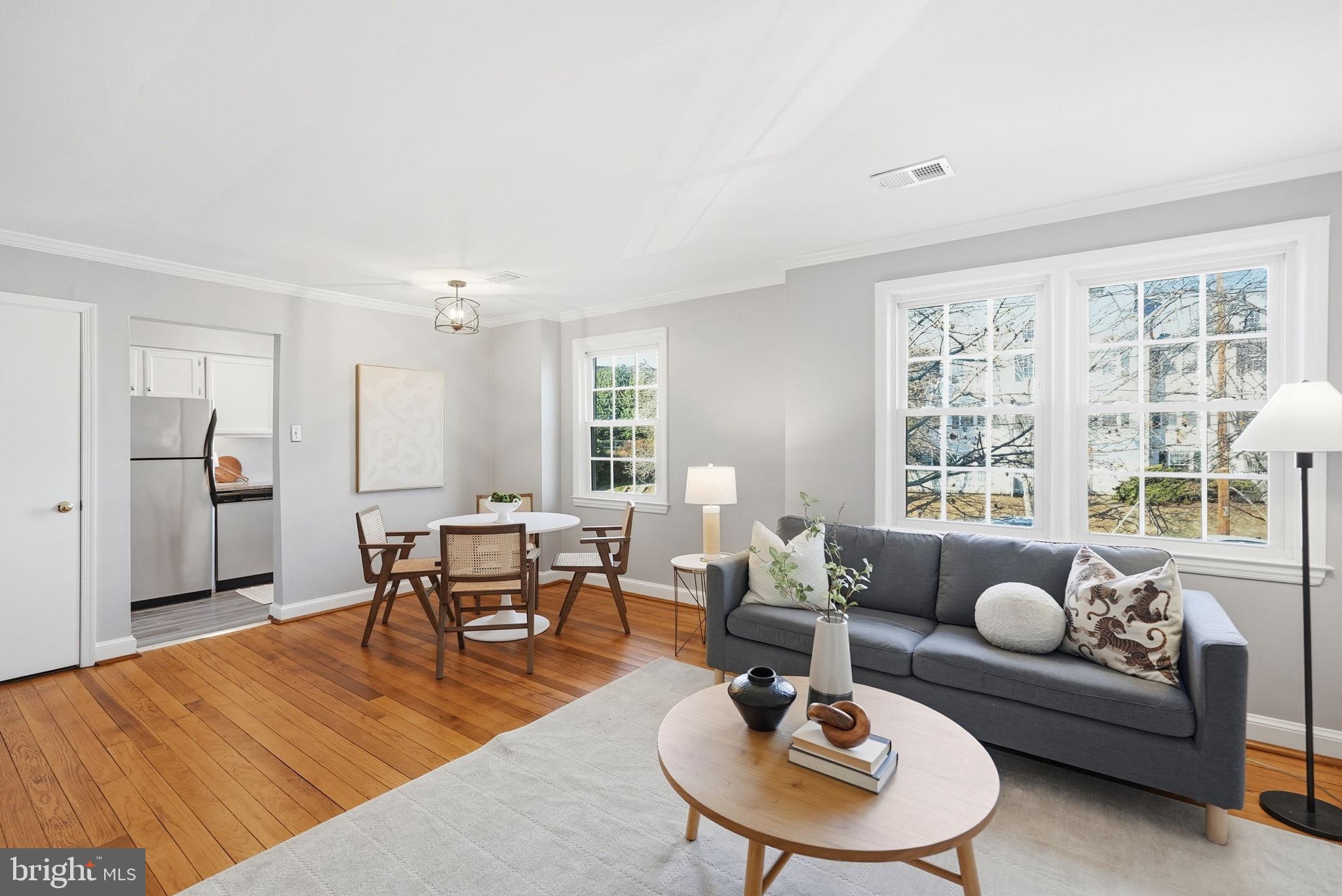 2900 13th Road South, Unit 201 Arlington, VA 22204 - Photo 5 of 32 a living room with furniture and a large window
