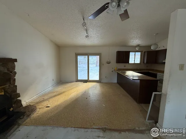 a view of a kitchen with a sink cabinets and window