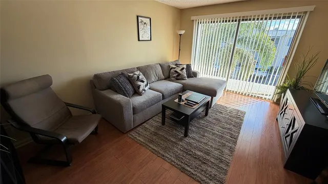 a living room with furniture and a window