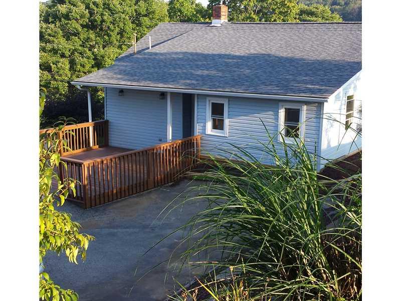 125 Johnetta Road Vandergrift, PA 15690 - Photo 1 of 20 Exterior Front. Paved Driveway, Large Deck, Plenty of annual plants
