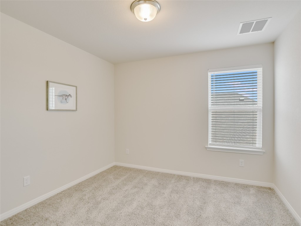 2818 Rustic Hills Drive Round Rock, TX 78665 - Photo 20 of 26 an empty room with a window