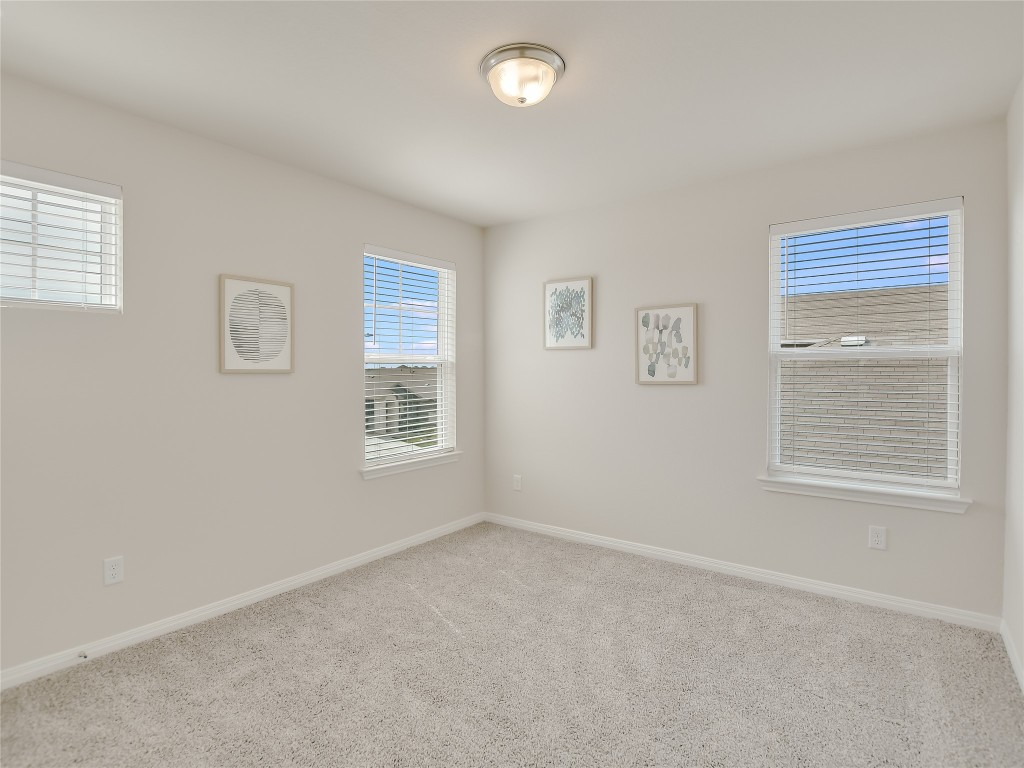2818 Rustic Hills Drive Round Rock, TX 78665 - Photo 21 of 26 a view of an empty room with a window