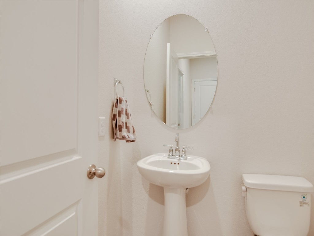2818 Rustic Hills Drive Round Rock, TX 78665 - Photo 22 of 26 a bathroom with a sink and mirror