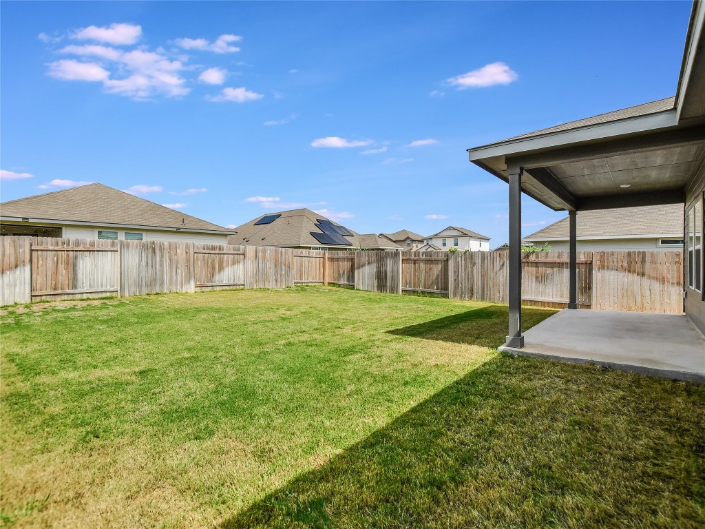 2818 Rustic Hills Drive Round Rock, TX 78665 - Photo 23 of 26 a view of an house with backyard and a tree