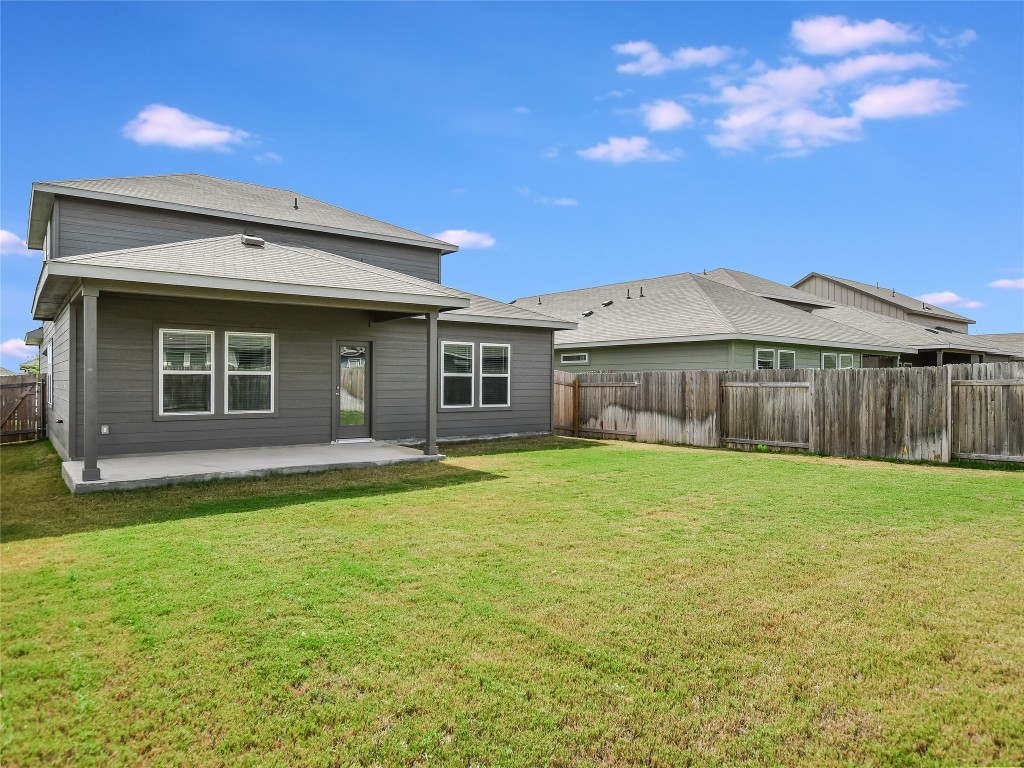 2818 Rustic Hills Drive Round Rock, TX 78665 - Photo 24 of 26 a front view of a house with a garden