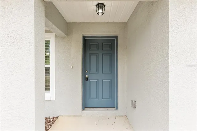 a kitchen with stainless steel appliances a sink a stove a microwave a refrigerator a window