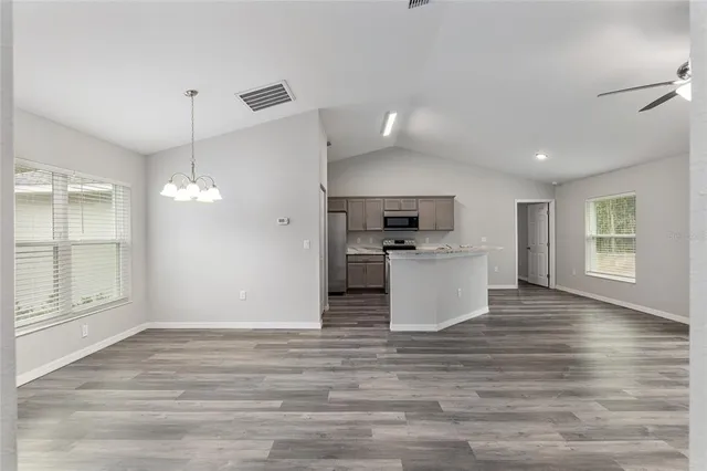 a kitchen with a refrigerator stove and microwave