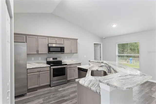 a bathroom with a toilet a sink and a mirror