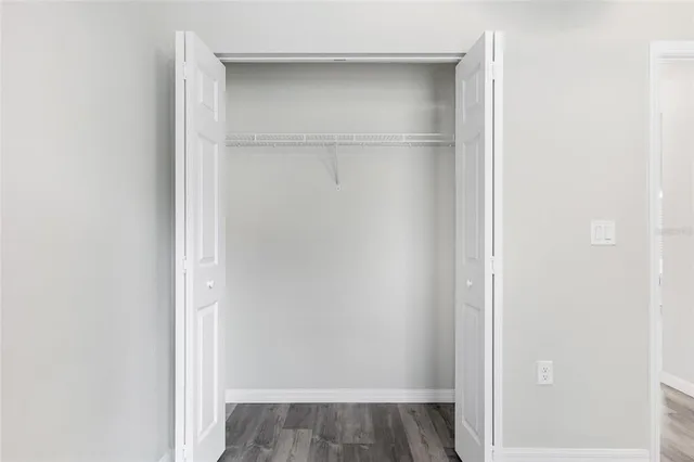 a view of a swimming pool with a yard