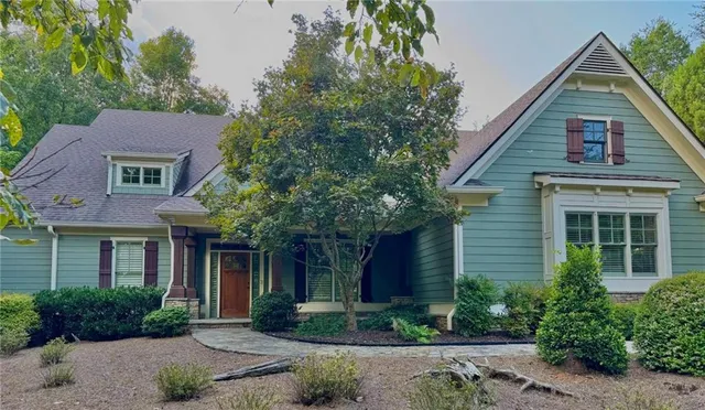 a front view of a house with garden
